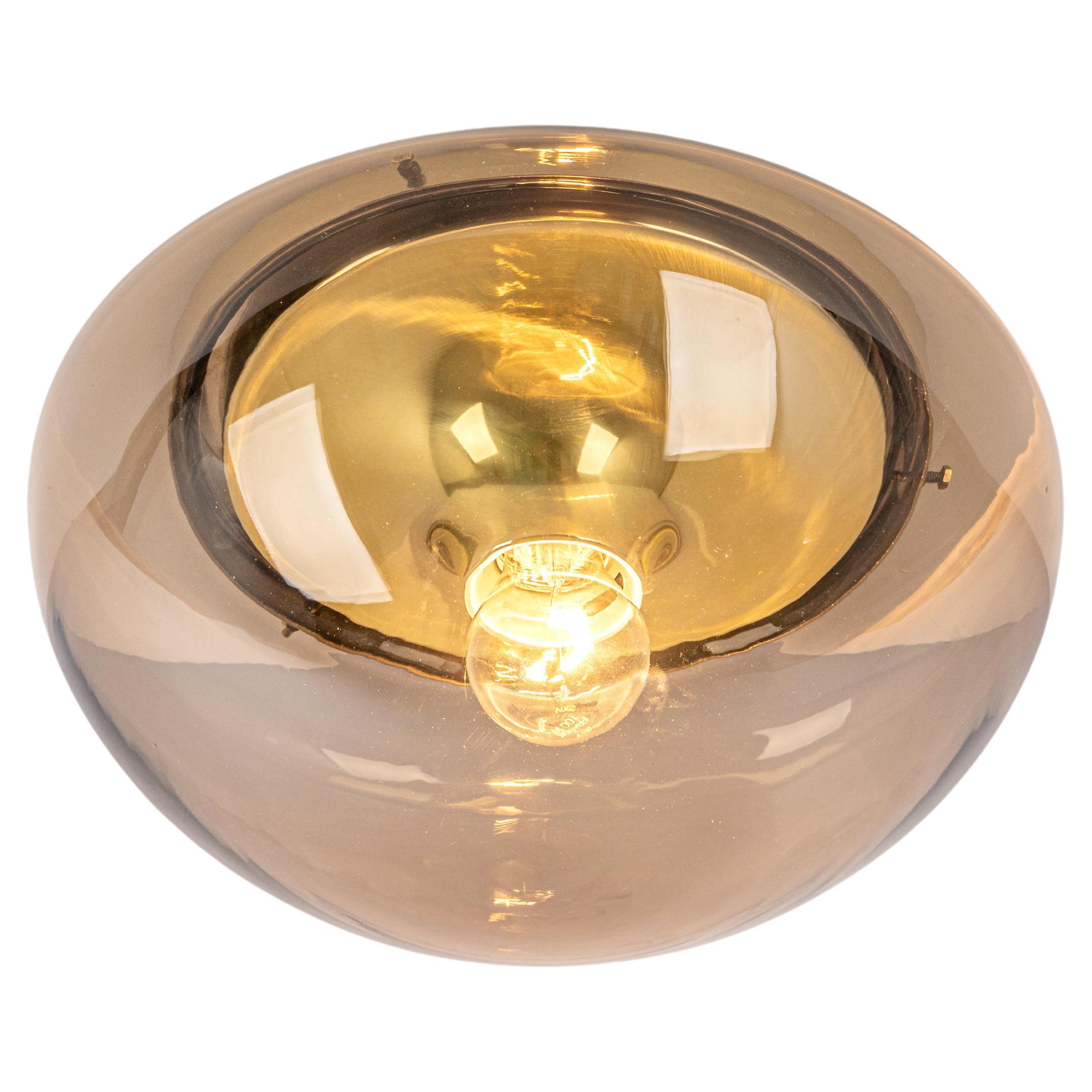 1 of 2  round glass flush mount with smoked glass by Limburg, Germany, 1970s.
Smoked glass fixtured on a brass base.

Good condition. Cleaned, well-wired and ready to use. 

The fixture requires 1 x E27 Standard bulbs with 60W max each 
Light bulbs