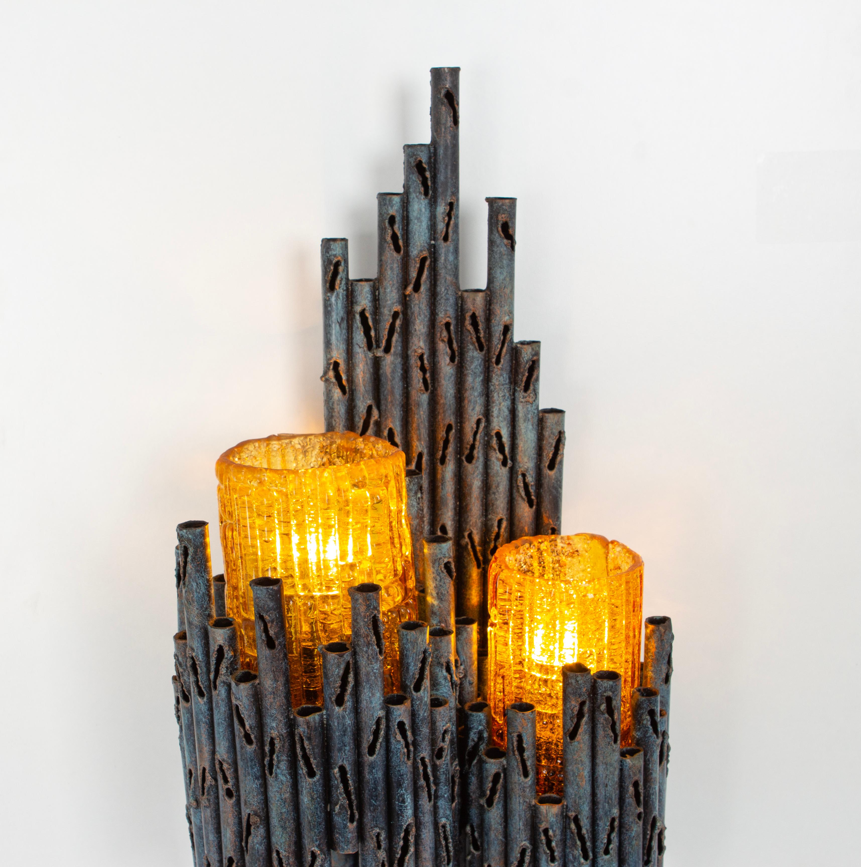 Wonderful mid-century wall sconces designed by Tom Ahlstrom and Hans Ehrlich, Sweden, circa 1960-1969.
Nice Brutalist shape with a unique Murano glass.

Each sconce needs two x E27 standard bulb.
Very good condition.

Please note the price listed is