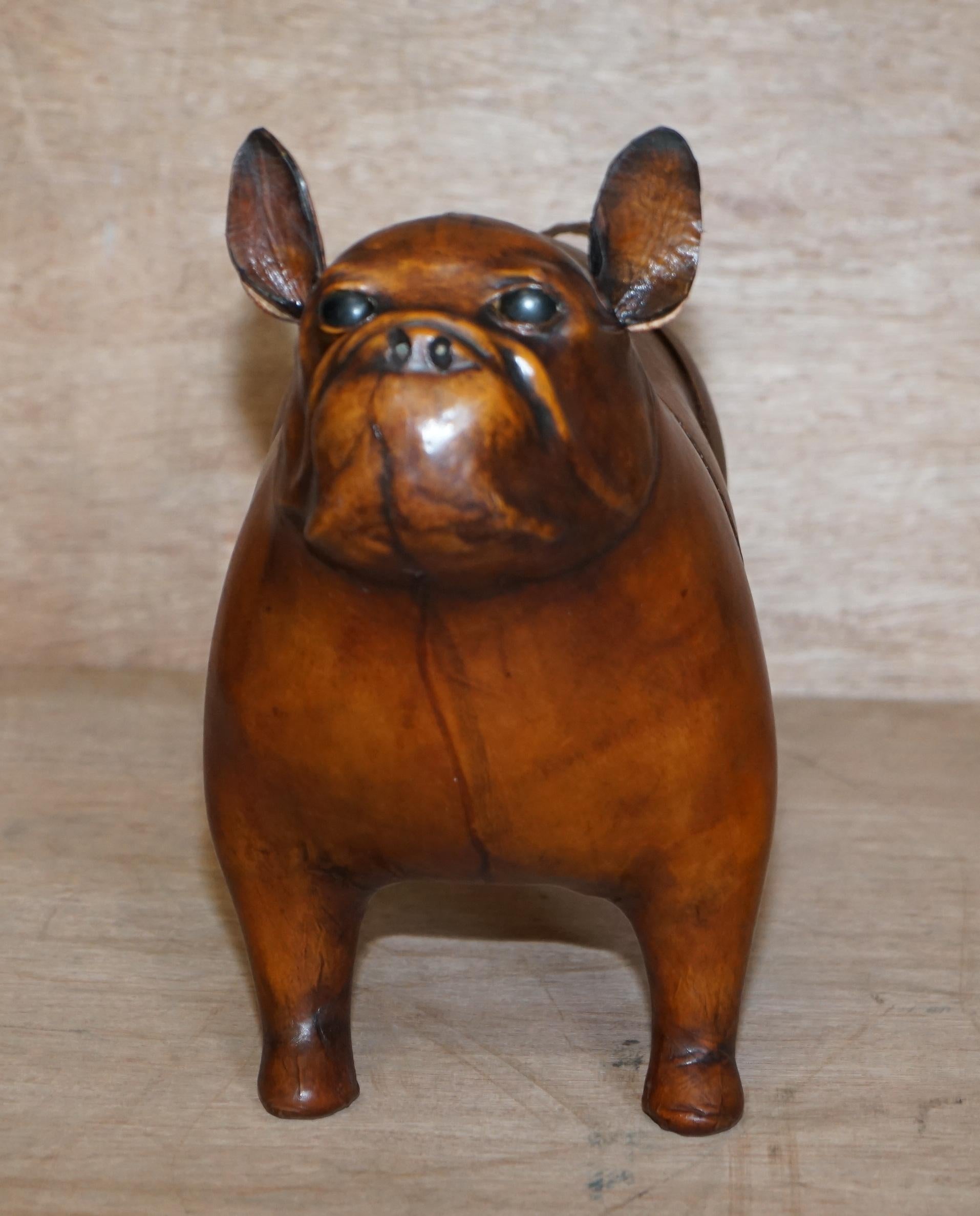 We are delighted to offer for sale this absolutely sublime new old stock original Liberty’s London Omersa style brown leather hand dyed French Bulldog footstools

These come in varying sizes there is a quite unpractical extra large size which is