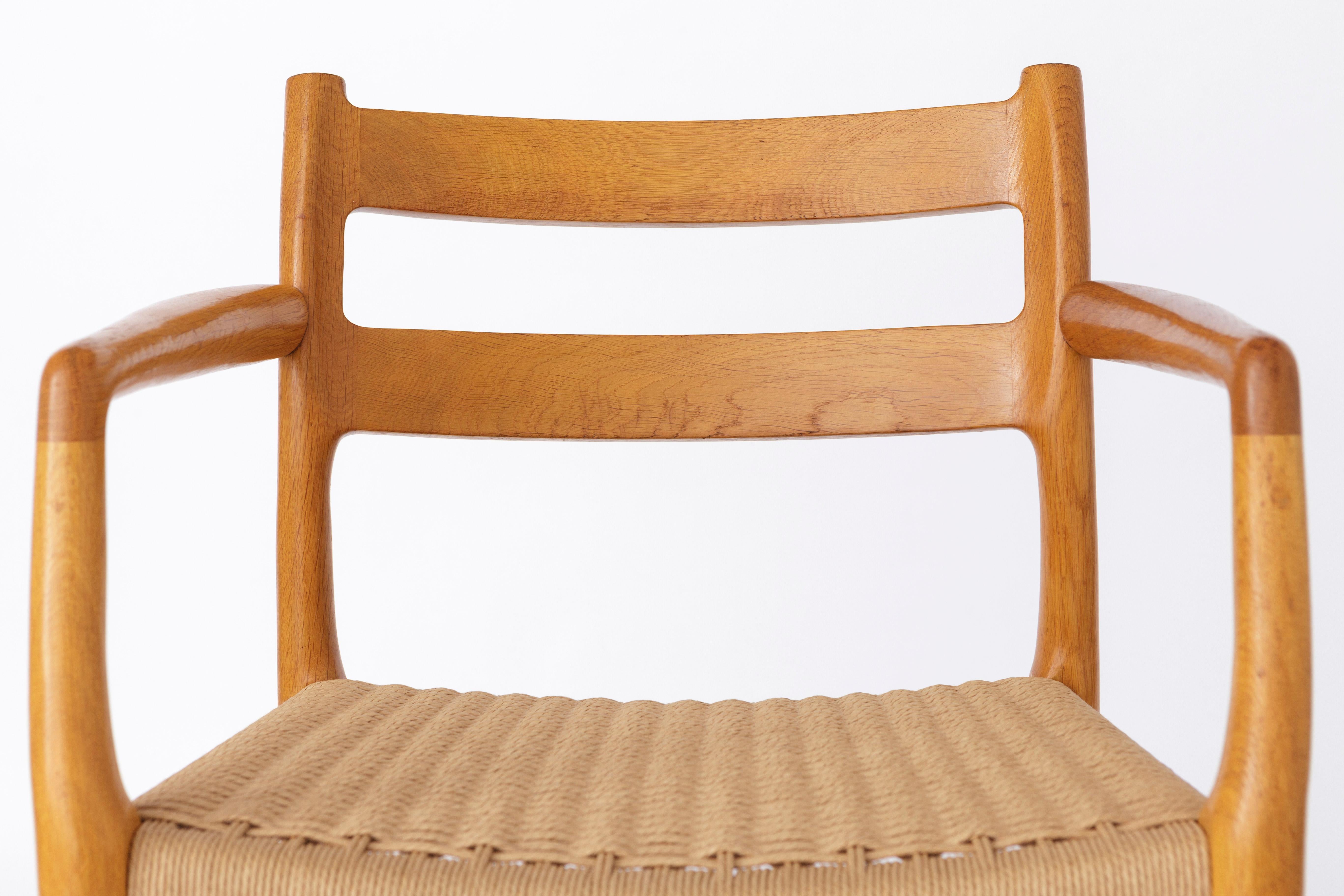 Vintage armchair by Niels Otto Moller, Denmark. 
Model 67, designed in 1976. 
Displayed price is for 1 chair, totally 2 available. 

Very good condition. Sturdy oak chair frame. Refurbished and oiled. 
Renewed seat weaving (on both chairs). 
Further