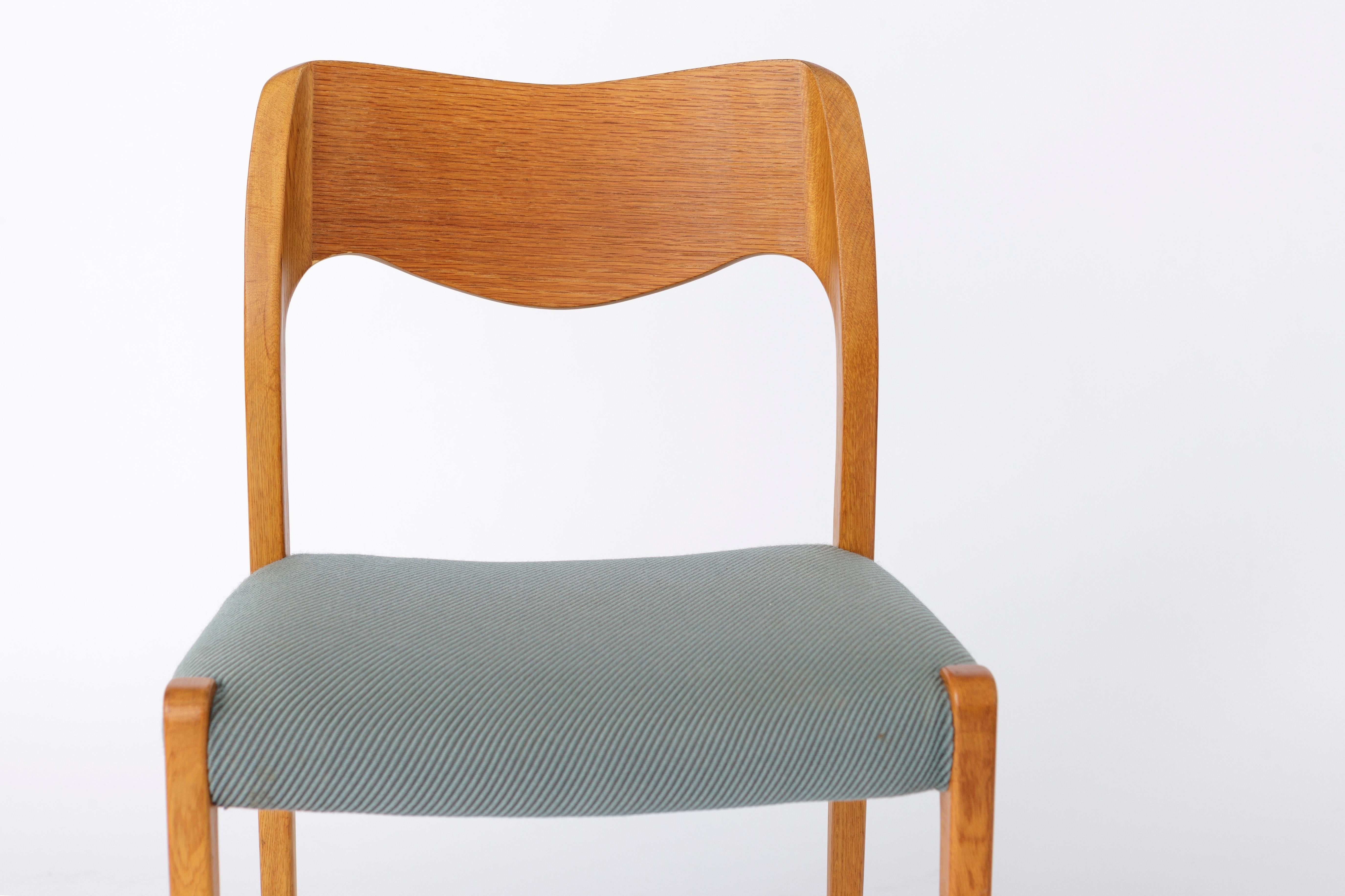Niels Otto Moller chair in the version oak wood. 
Production period: 1950s. 
Displayed price is for 1 chair. Totally up to 2 chairs available. 

Good vintage condition. Small defects in the veneer. See last pictures. 
Hardly visible though.
Sturdy
