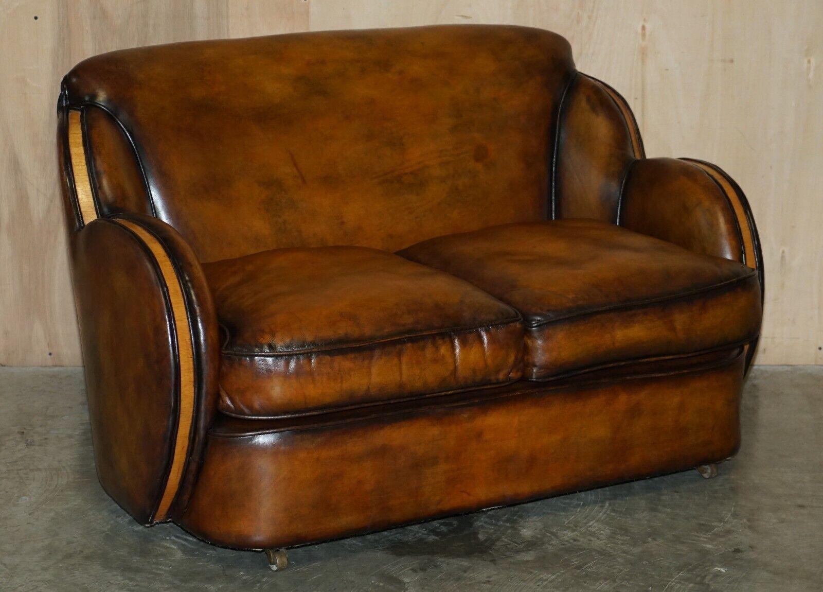 Royal House Antiques

Royal House Antiques is delighted to offer for sale this 1 of 2 of very rare Harry & Lou Epstein Art Deco two seat Cloud sofas with Birch frames and one of a kind, hand dyed brown leather upholstery.

Please note the delivery