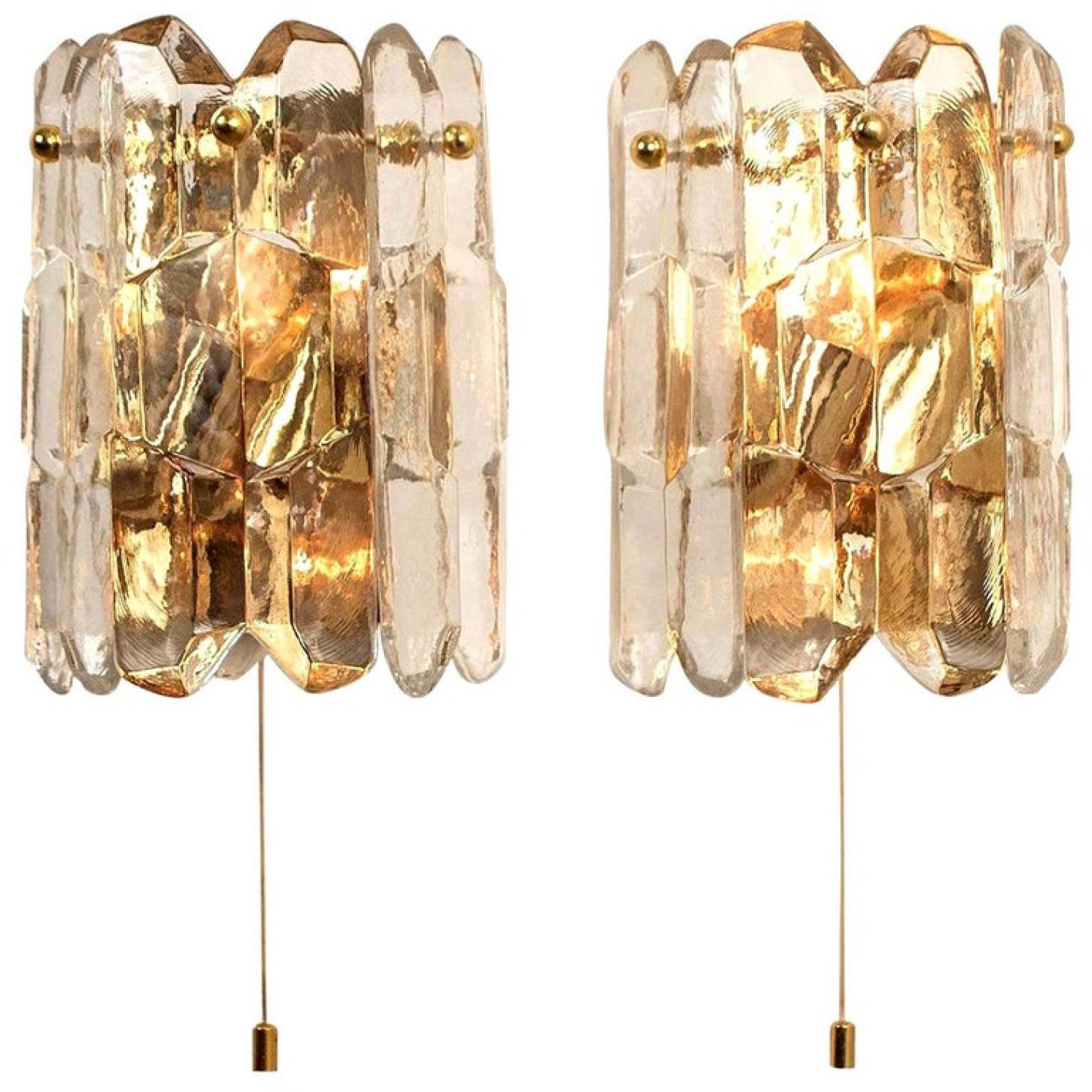 A pair of high-end and handmade gilt brass 24-karat gold-plated wall lights made by Kalmar in Austria. This model 