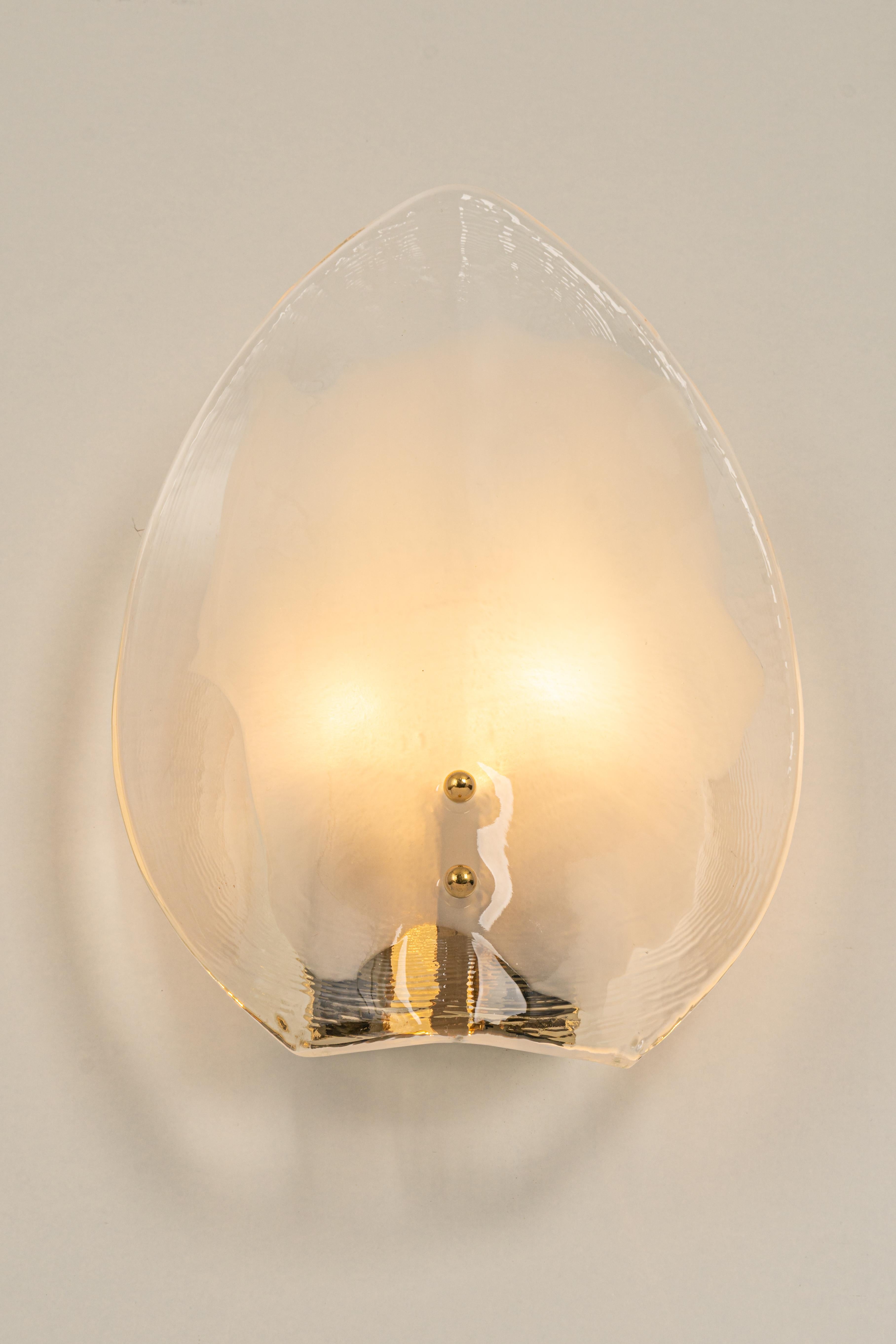 Wonderful mid-century wall sconce with Murano glass, made by Kalmar, Austria, manufactured, circa 1960-1969.
The frame is gilt brass.
High quality and in very good condition. Cleaned, well-wired, and ready to use.  

Each sconce requires 2 x E14