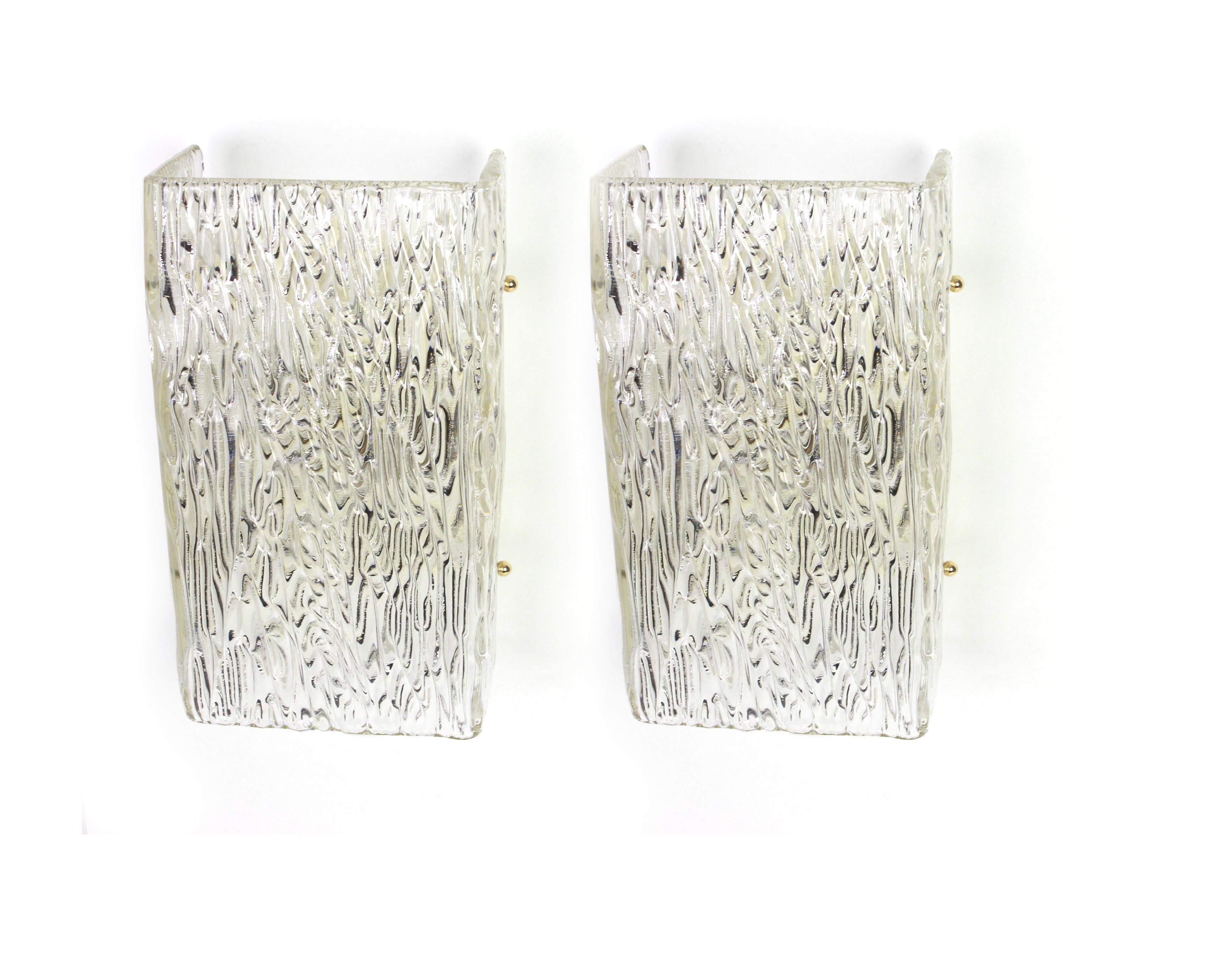 Wonderful pair of midcentury wall sconces with large Murano glass piece on a frame in each wall lamp, made by Kalmar, Austria, manufactured, circa 1960-1969.
Each sconce needs two x E27 standard bulbs and they are also compatible with the US