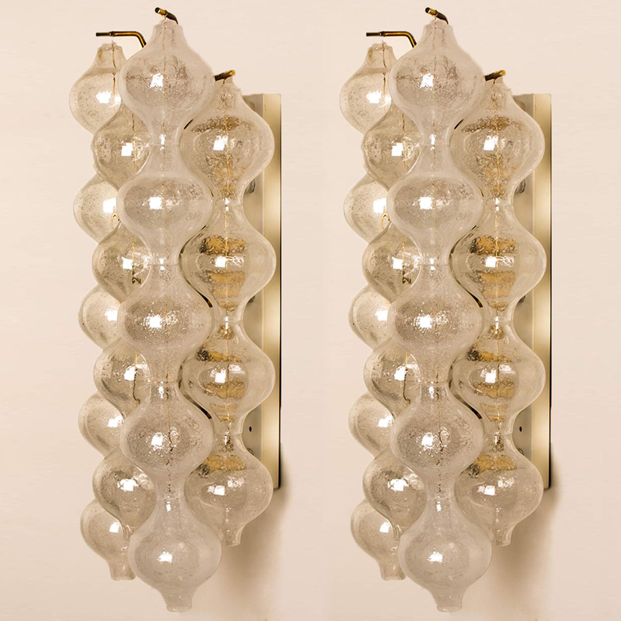1 of the 2 unique pairs extra large and elegant 'Tulipan' glass wall sconces by J.T. Kalmar, Austria, Vienna, manufactured in mid-century, circa 1970 (late 1960s or-early 1970s). Tulip shaped hand blown bubble glasses. With a white enameled metal