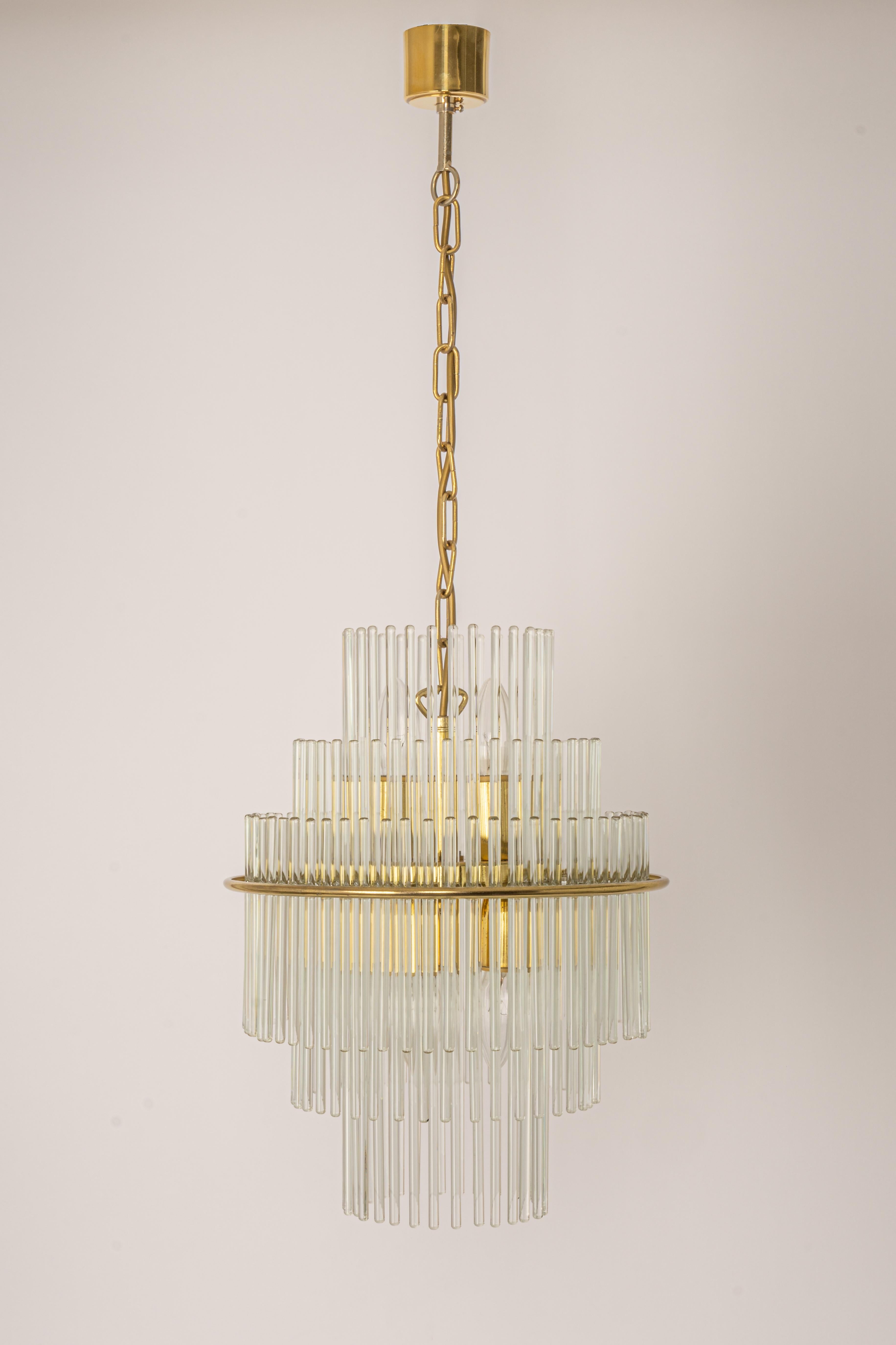 1 of 2 Petite crystal glass rod pendant light, Germany, 1970s. 
Wonderful light effect.
Sockets: It needs 5 x E14 small bulbs ( max. 40 Watts each)
Light bulbs are not included. It is possible to install this fixture in all countries (US, UK,
