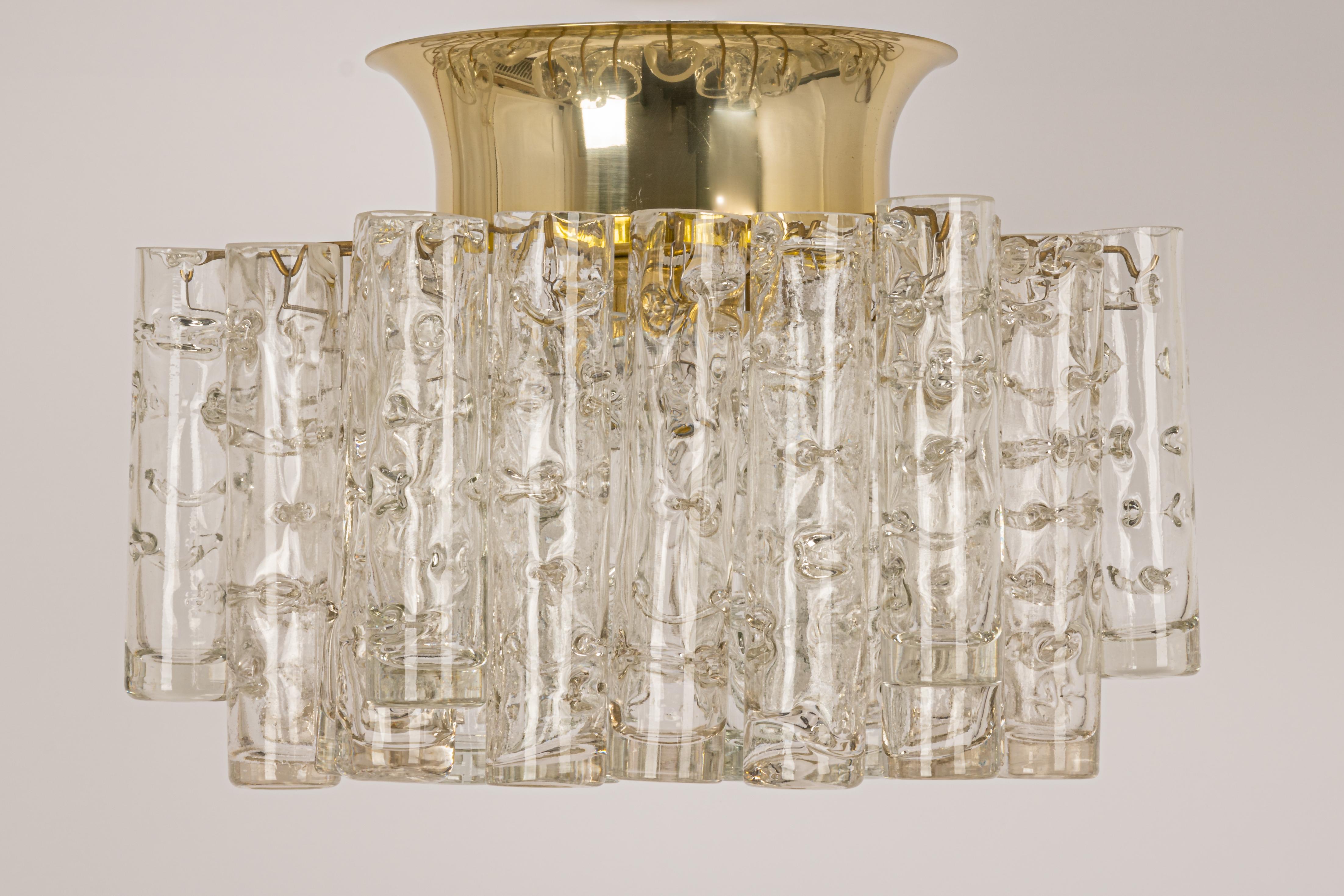 1 of 2 Fantastic mid-century chandeliers by Doria, Germany, manufactured circa 1970-1979. A lot of Murano glass cylinders are suspended from the fixture.
Heavy quality and in very good condition. Cleaned, well-wired, and ready to use.

The