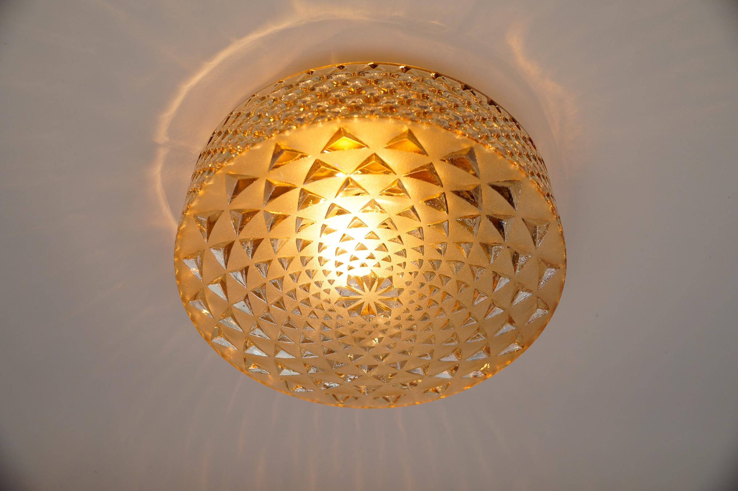 Mid-Century Modern 1 of 2 Round Geometric Satin Amber Glass Flush Mount Light or Wall Lamp, 1960s For Sale