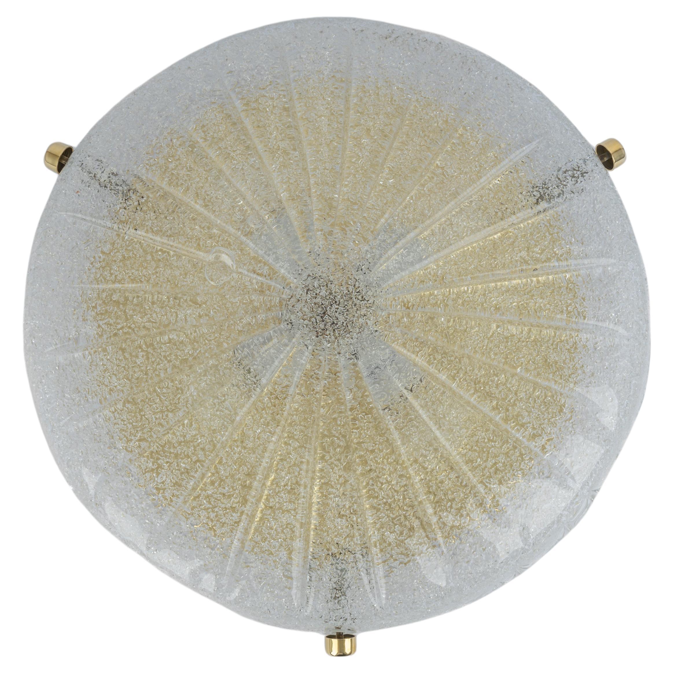 A wonderful round Murano flush mount by Hillebrand Leuchten, Germany, 1970s.
Thick textured Murano fixture on a brass base with 3 brass screws.

High quality and in very good condition. Cleaned, well-wired and ready to use. 

The fixture requires 4