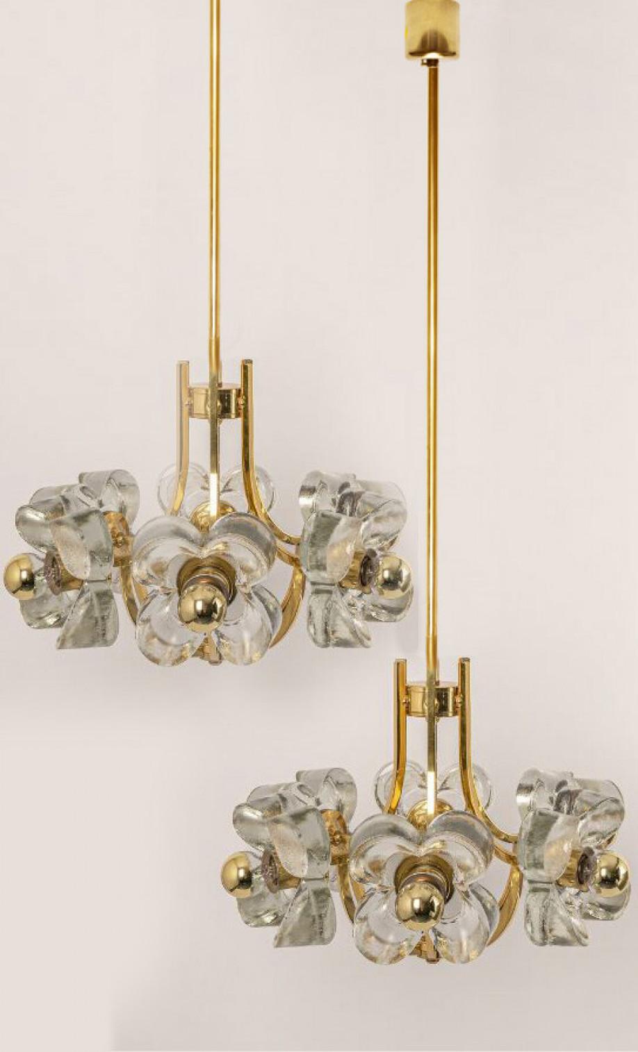 This ceiling light was designed by Simon and Schelle, featuring a rectangular brass base and six massive glasses in the shape of a three lobed flower.

Dimensions:
Height 37.41 (95 cm)
Diameter 17.72 (45 cm)

Please notice the price is for 1 piece,