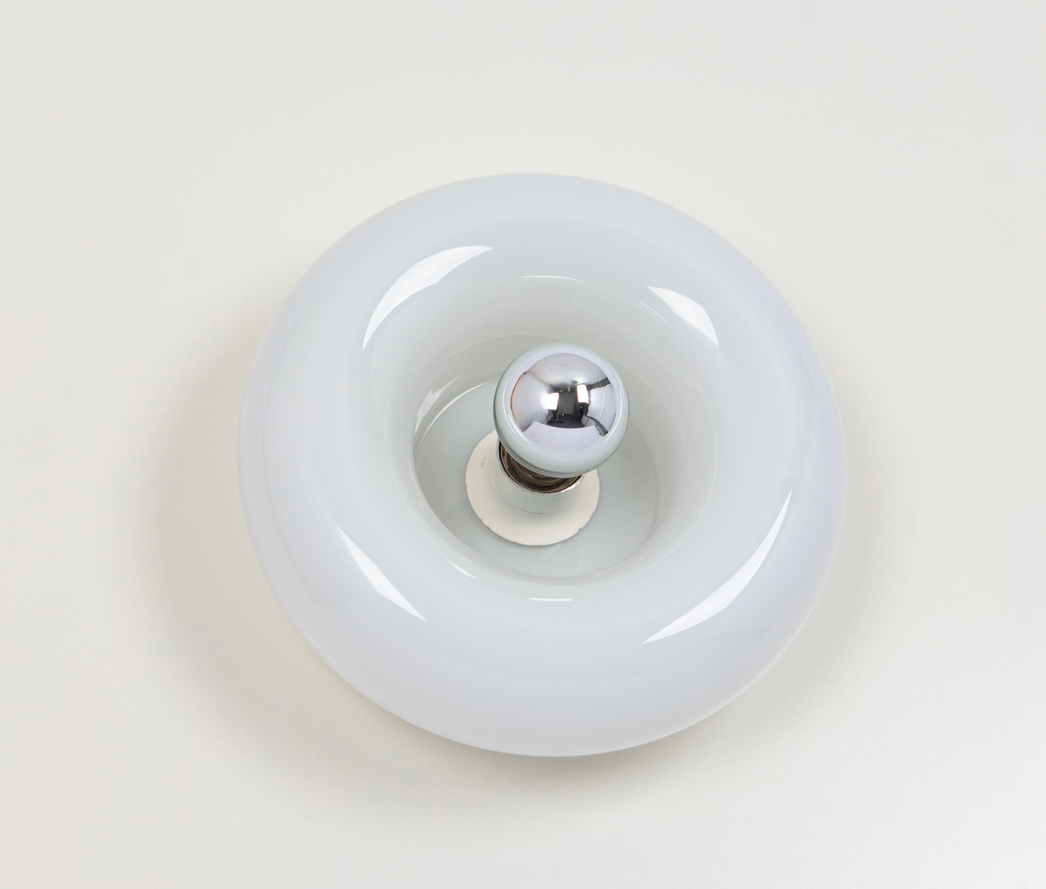 Special round biomorphic Opal Murano glass wall light in Doughnut shape designed Doria Leuchten, Germany, manufactured, circa 1960-1969.
High quality, good condition.
Very nice light effect.
Cleaned, well-wired, and ready to use.

Each sconce