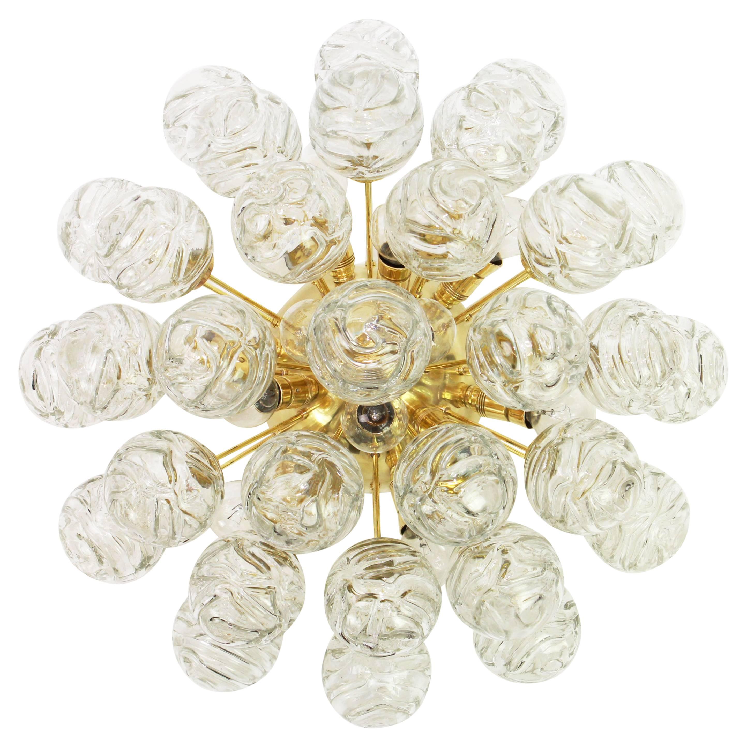 Spectacular Sputnik flush mount with glass snowballs designed by Doria, Germany, 1970s
All glass balls are in good condition.
It needs 12 small size bulbs (E-14 bulbs) up to 40 watts each.
Light bulbs are not included. It is possible to install