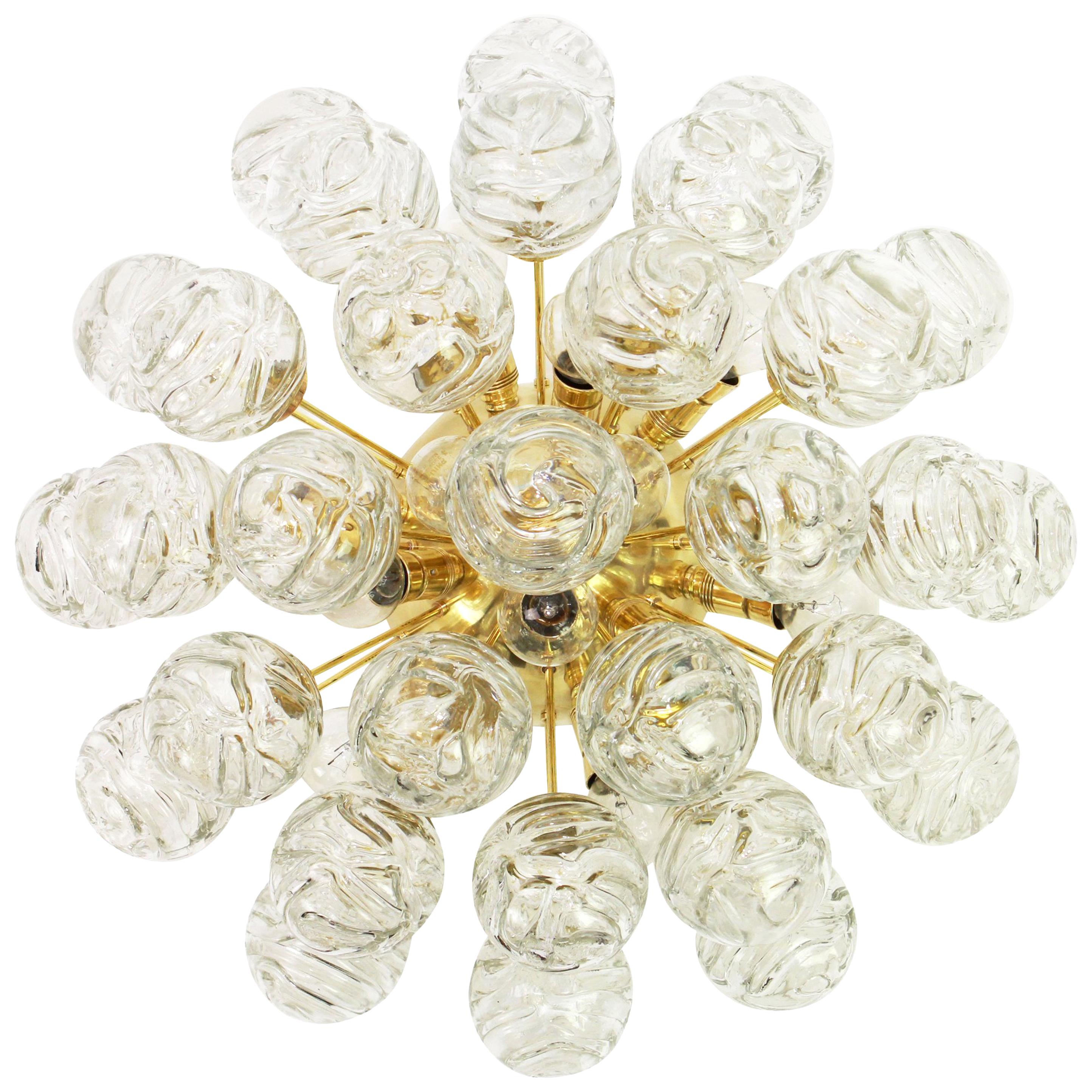 Spectacular Sputnik flushmount with glass snowballs designed by Doria, Germany, 1970s
All glass balls are in good condition.
It needs 12 small size bulbs (E-14 bulbs) up to 40 watts each.
Light bulbs are not included. It is possible to install