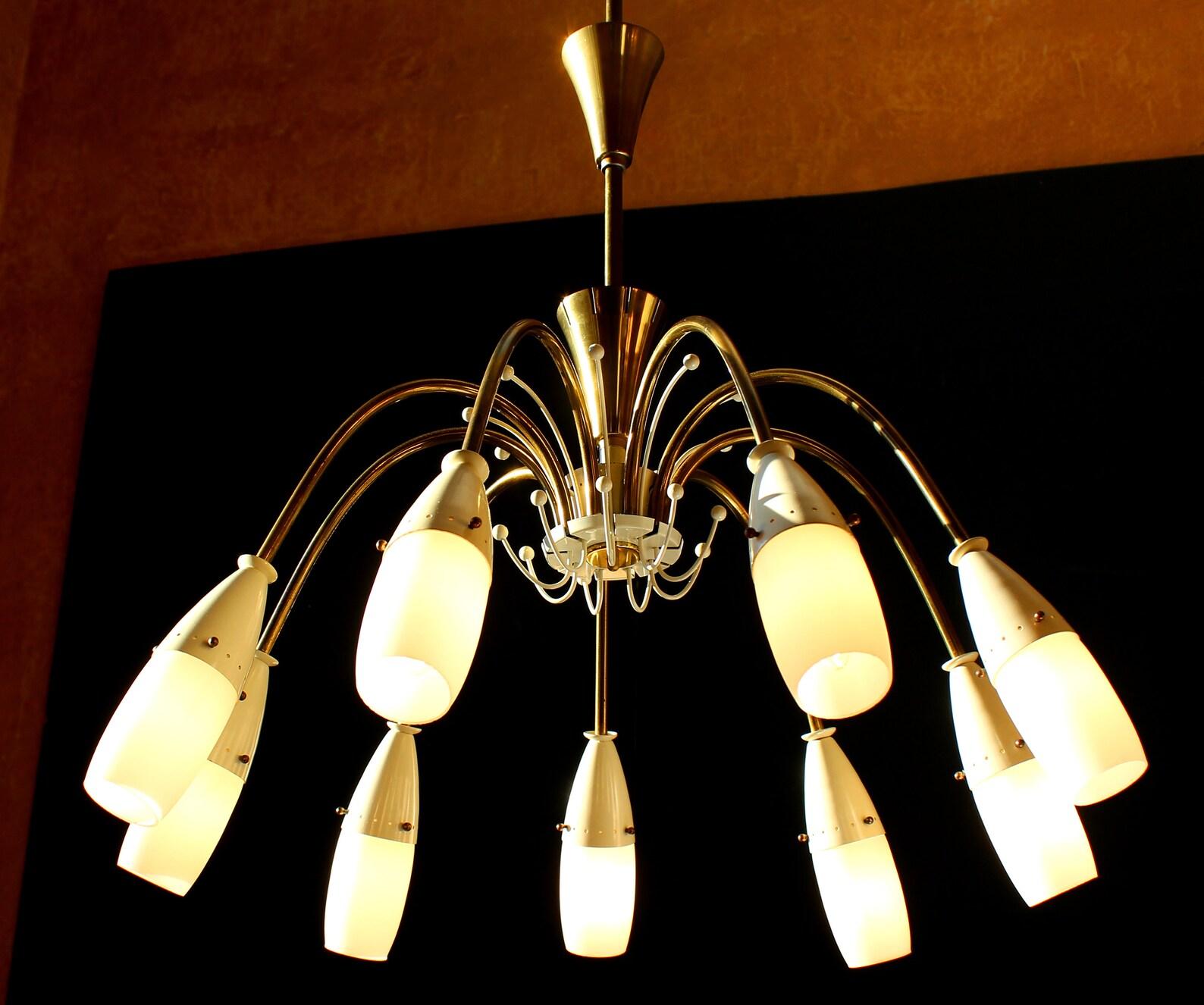 WHITE SPIDER SPUTNIK CHANDELIER 9 LIGHTS E14 WITH OPAL GLASS TULIPS
LBL GERMANY LEIPZIG 1959. REWIRED

DIAMETER 23 INCHES, ORIGINAL HEIGHT 32 INCHES

German design from the 50s to 70s is leaving the world some valuable modern classics. This