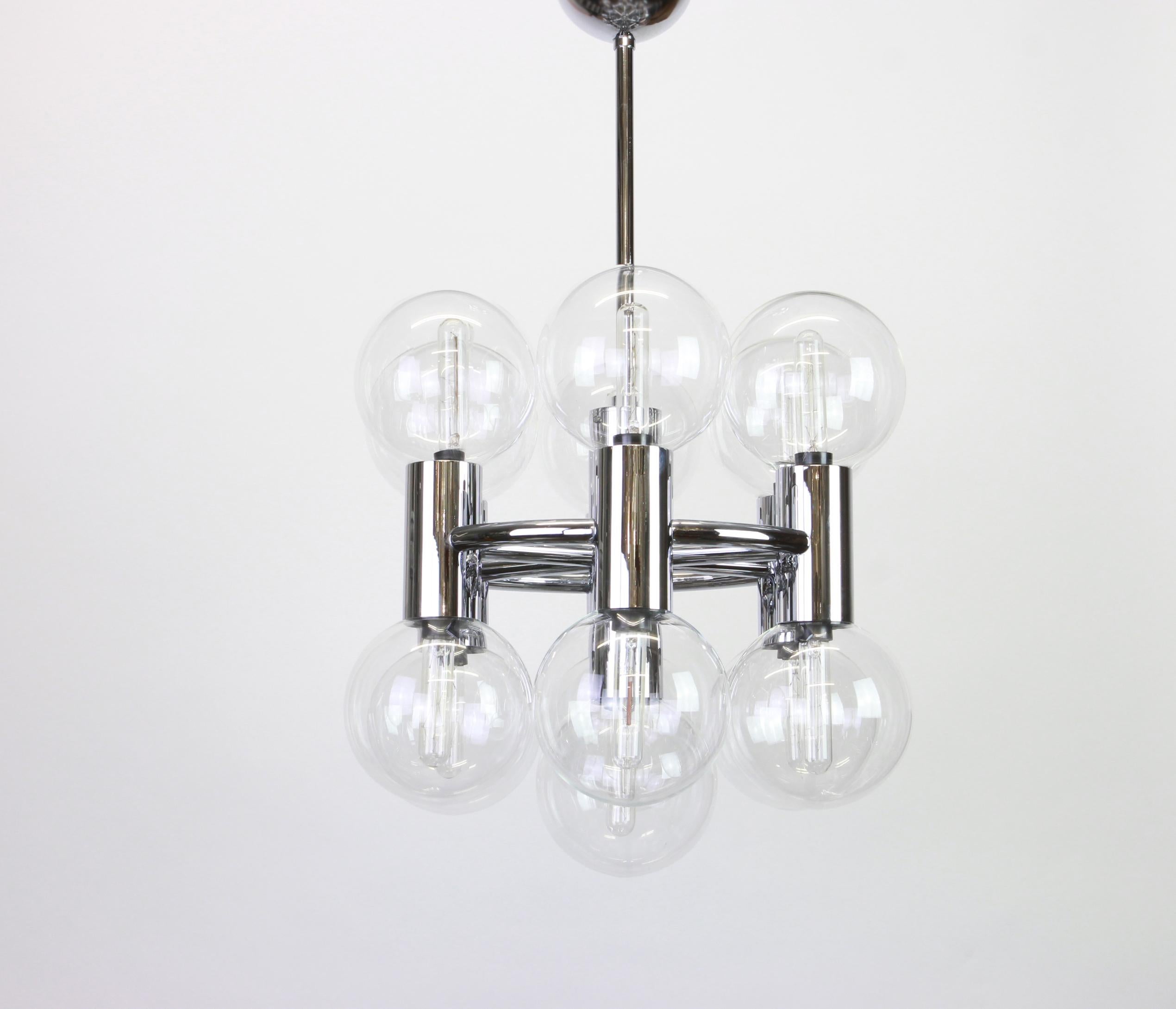 1 of 2 wonderful midcentury Sputnik chrome chandelier designed by Motoko Ishii made for Staff Leuchten, manufactured in Germany, circa 1970s.

High quality and in very good condition. Cleaned, well-wired and ready to use. 

The fixture requires