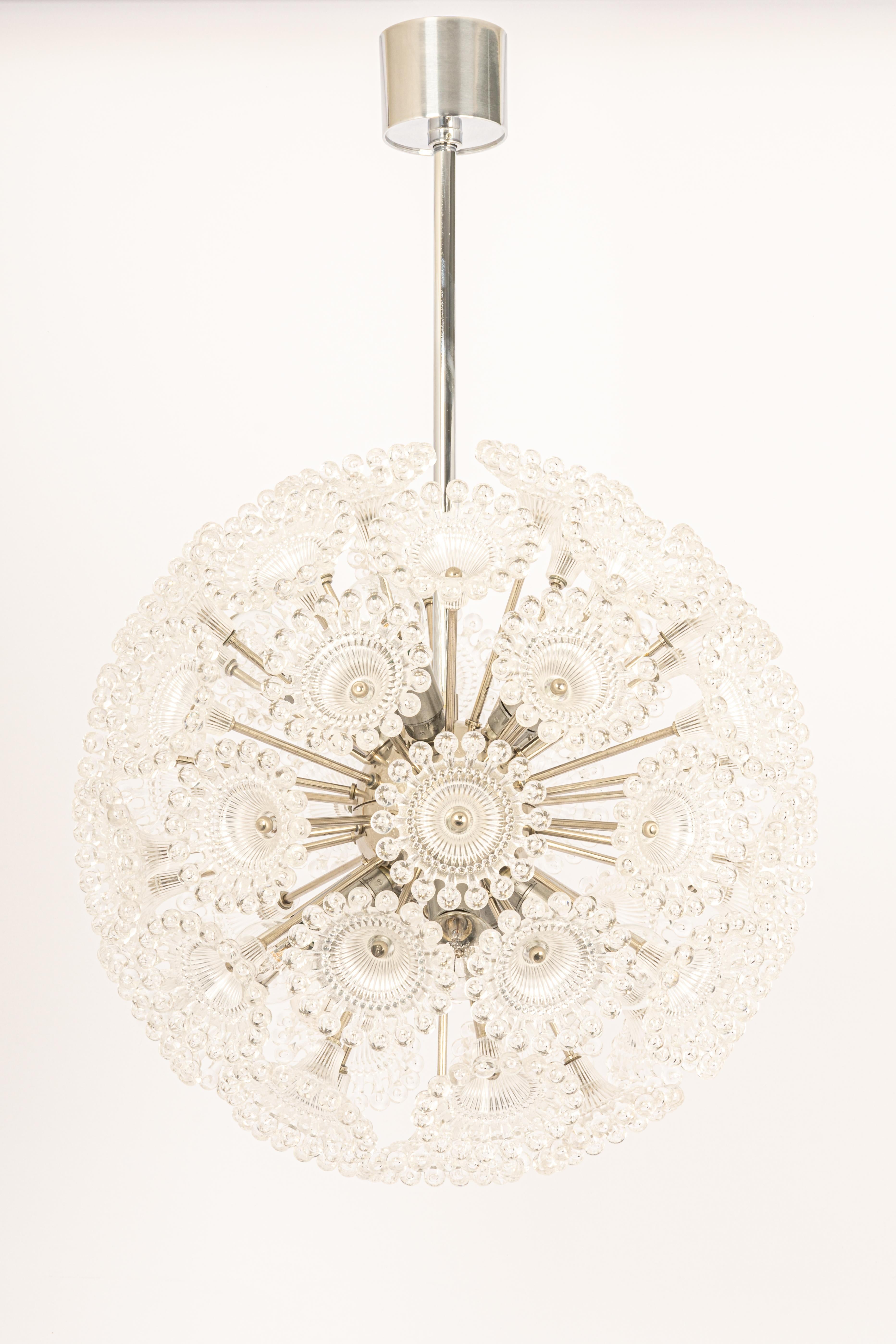 Stunning floral plexiglass and chrome Sputnik chandeliers, Germany, 1960s.

It requires 10 x E14 standard bulbs with 40W max each.
Light bulbs are not included. It is possible to install this fixture in all countries (US, UK, Europe, Asia,