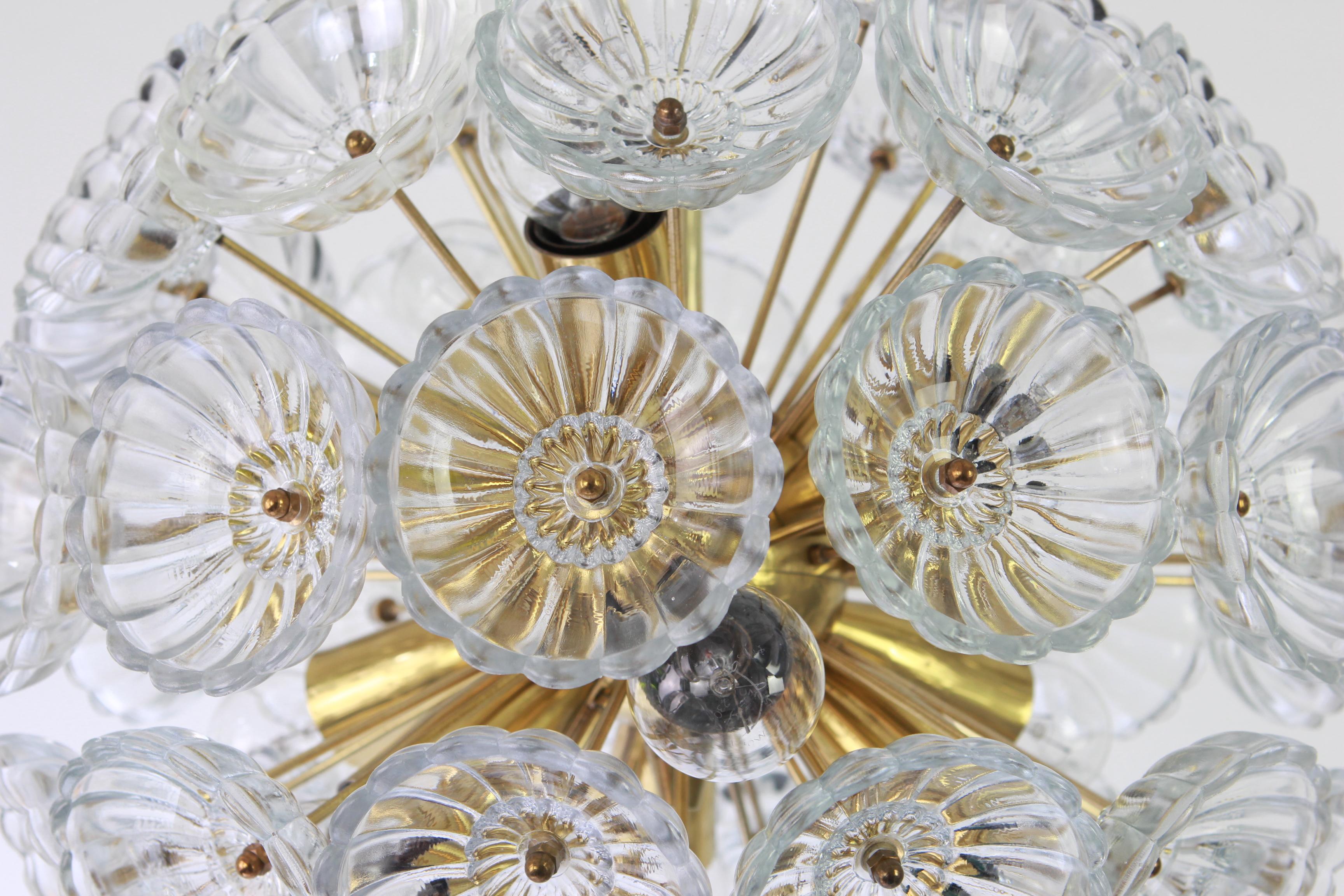 Stunning floral glass and brass Sputnik chandeliers, Germany, 1960s.

It requires 12 x E14 standard bulbs with 40W max each and compatible with the US/UK/ etc. Standards. Very good condition.
Drop rod can be adjusted as required, free of charge,