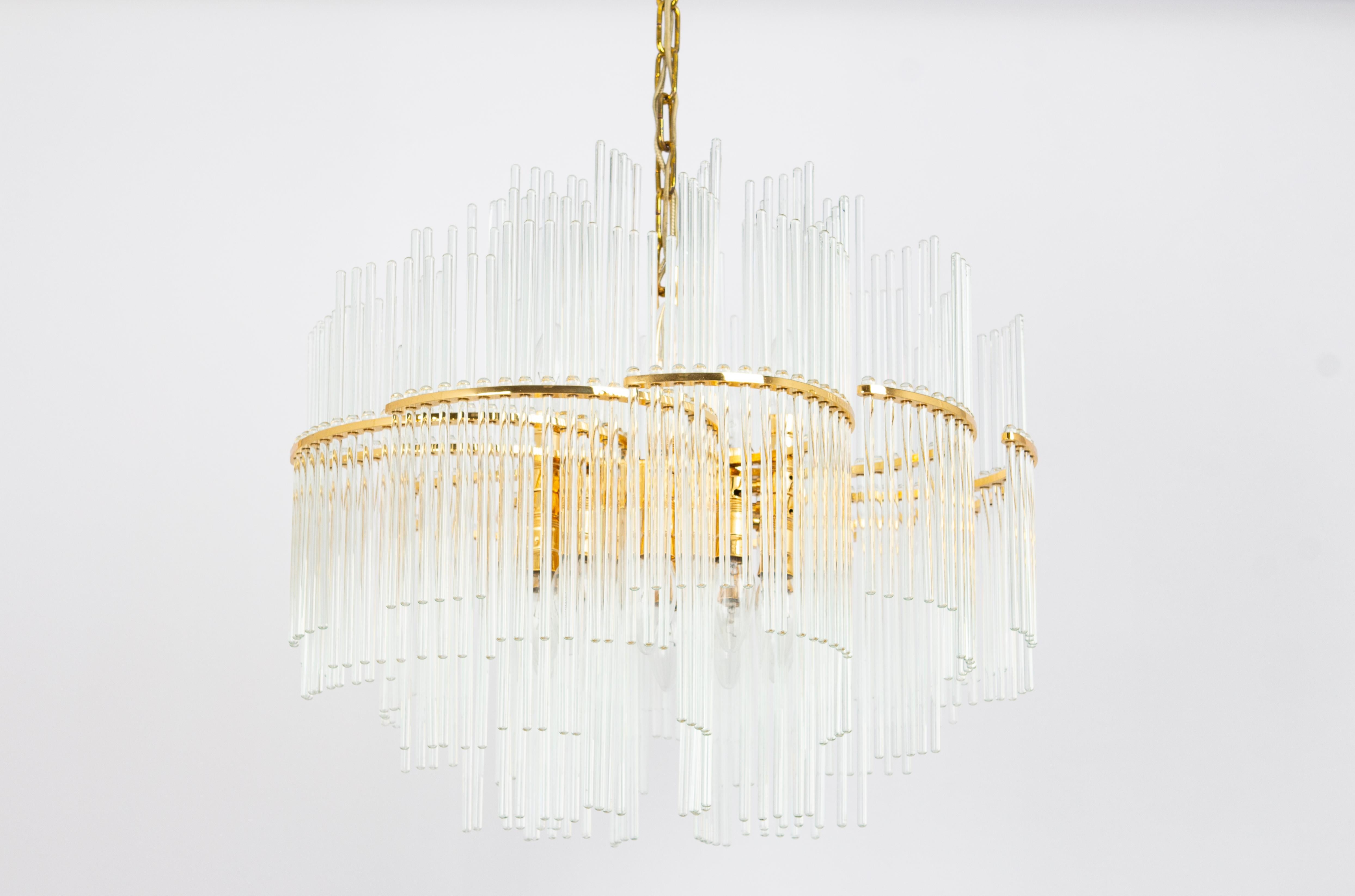 A stunning large chandelier by Palwa (Palme and Walter), Germany, manufactured in 1960s. It’s composed of crystal glass rods on gilt brass frame.

Sockets: It needs 15 x E14 small bulbs ( max. 40 Watts each)
Light bulbs are not included. It is