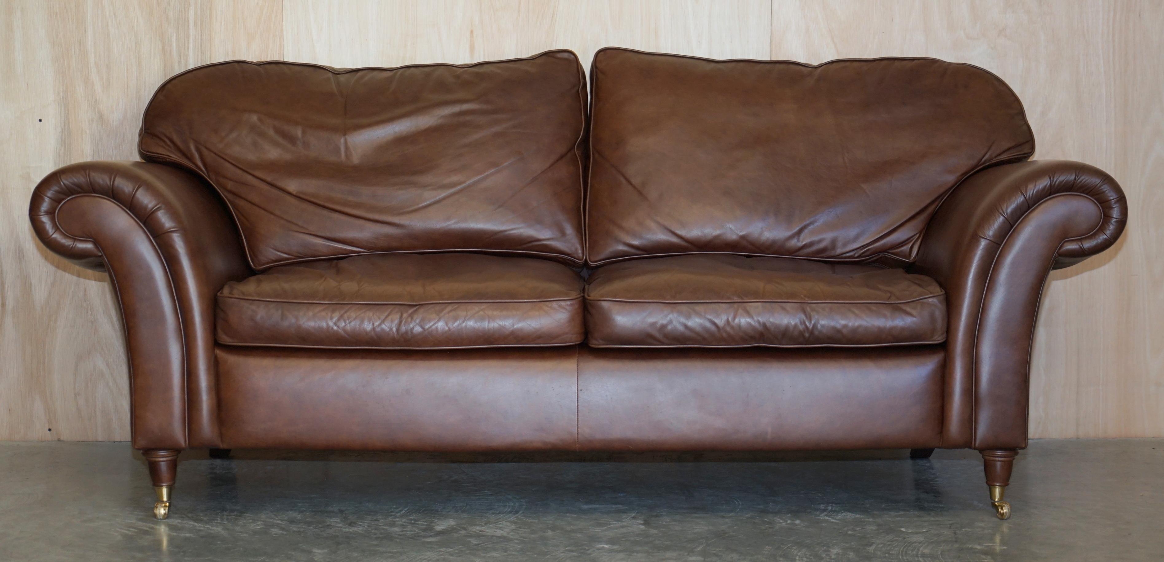 We are delighted to offer for sale this lovely Laura Ashley, Mortimer II heritage brown leather three seat sofa with castors

The sofa is very comfortable, it has fibre filled cushions which feel like feathers but retail there shape better

In