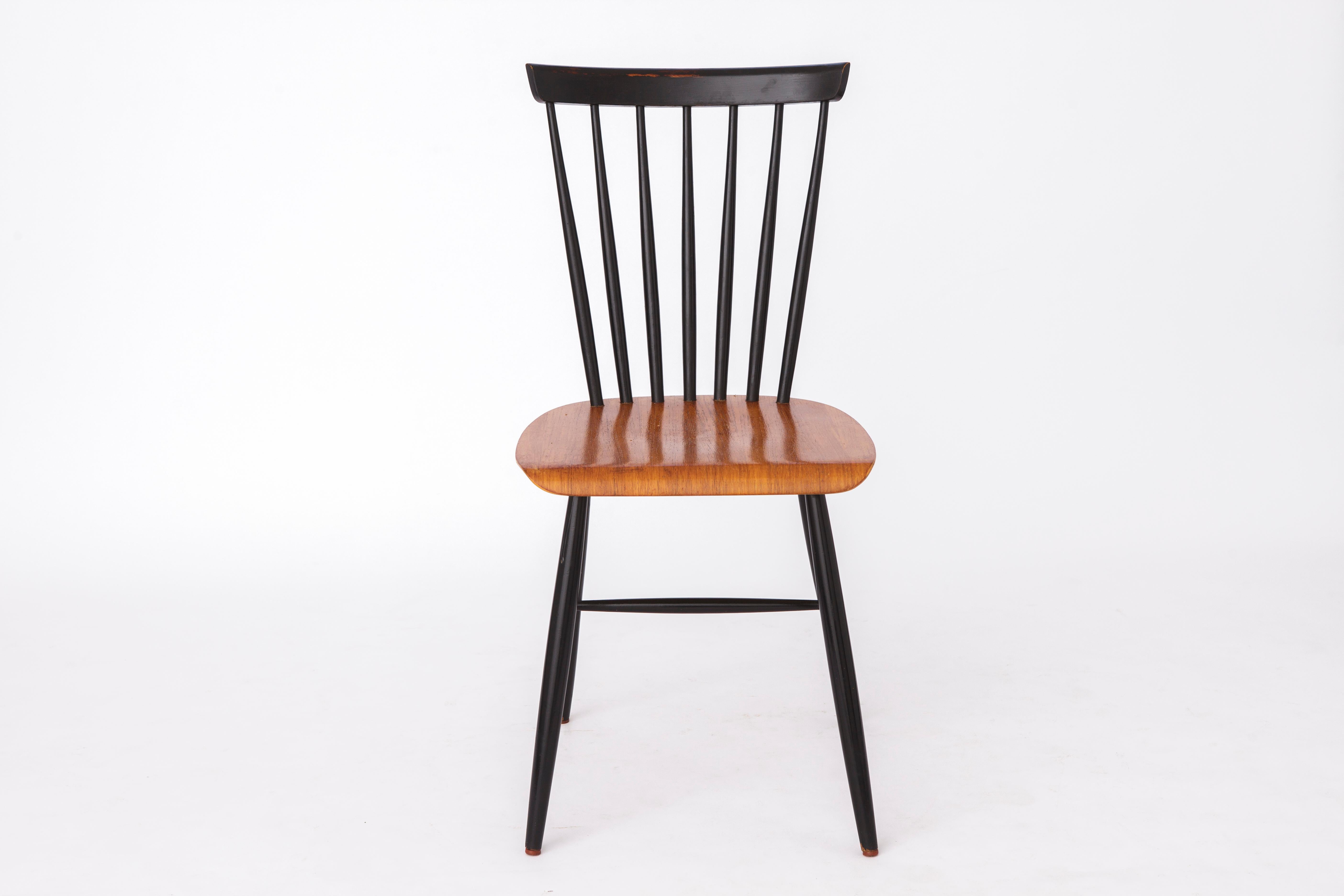 Vintage spindle back dining chair in the style of Ilmari Tapiovaara. 
Unknown manufacturer. 
Production period: 1960s-1970s. 
Totally 2 such chairs available. Displayed price is per piece. 
PS: I have two other similar chairs, if you are interested