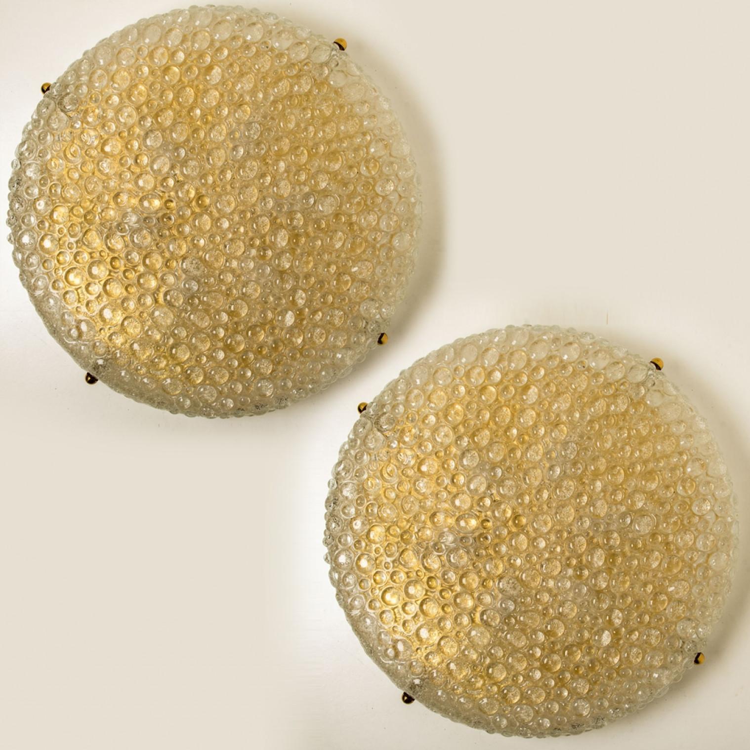 XL High quality modern thick textured ice glass flush mount, circa 1965. Each flush mount is featuring a huge round handmade glass disc. Can also work for impressive wall lights. The dish is handmade of 'Frit' glass. Many of tiny glass herds which