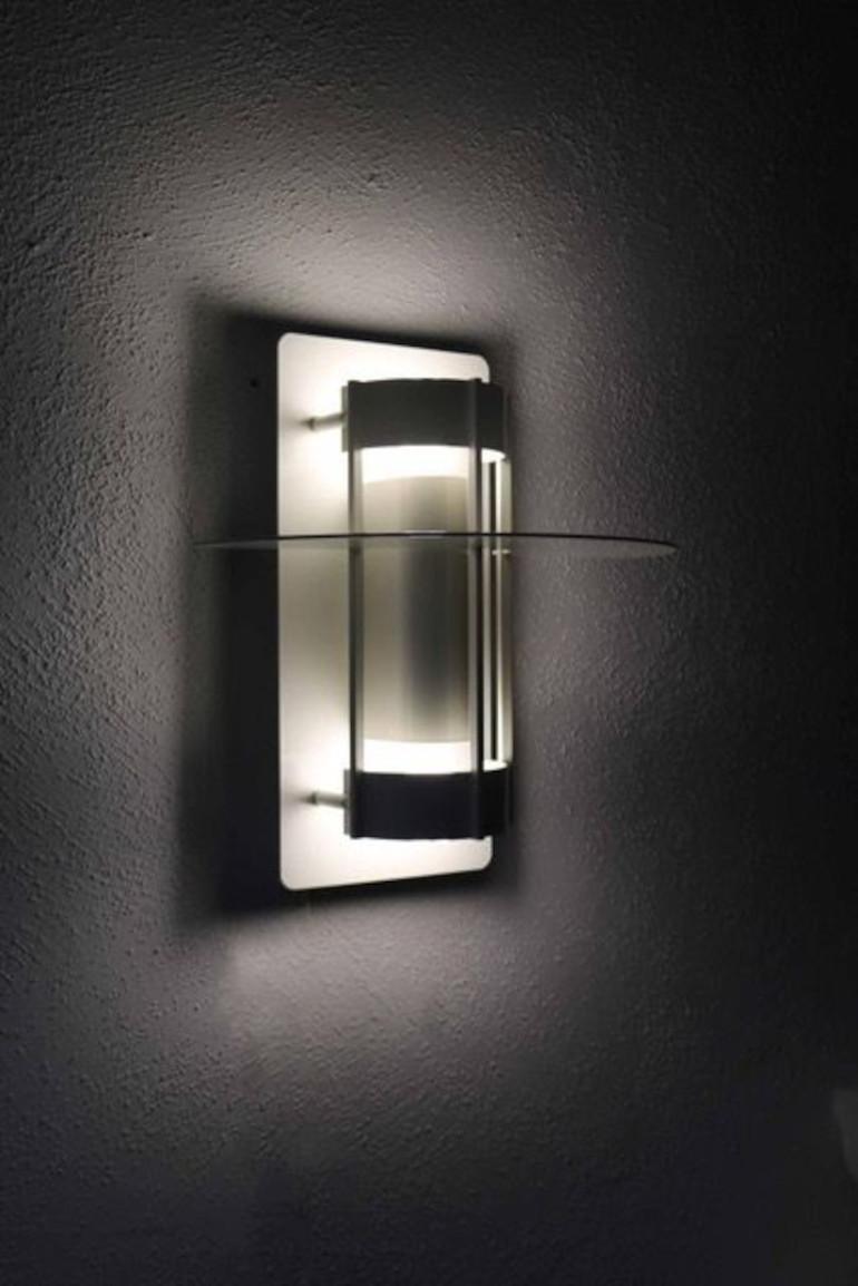 Louis Poulsen wall light Model Saturn. Design by Joachim Lepper. Bulbs are not included. 2x socket G24d-1 Plug Base. Good condition with only light signs of use. 24 pieces available.