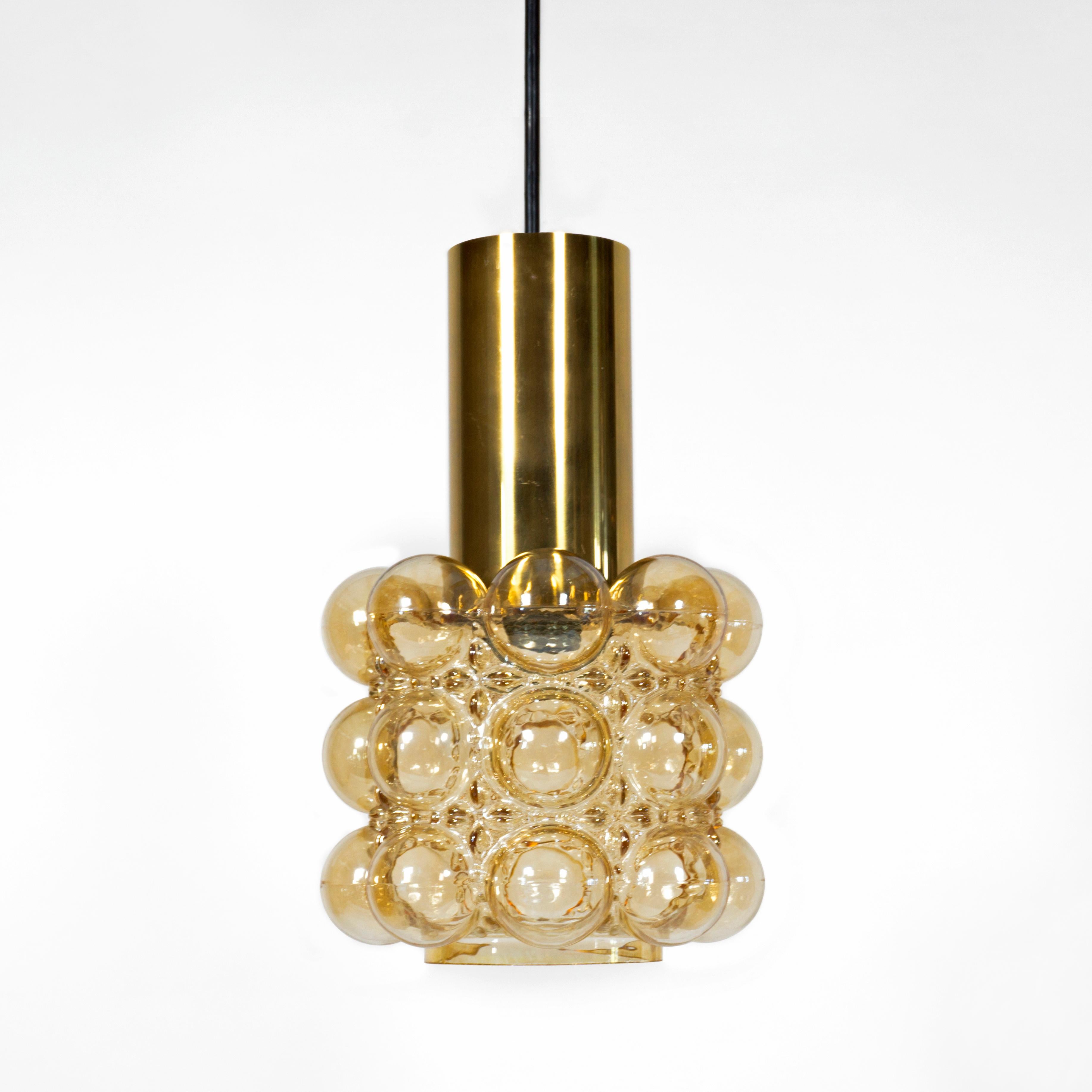 1 of 3 gorgeous vintage amber bubble glass pendant lights by Helena Tynell for Glashütte Limburg from the 1960s.
Thick, amber colored glass with a large brass tube. E27 socket.  
The lamp impresses with its great shape and the bubble amber glass