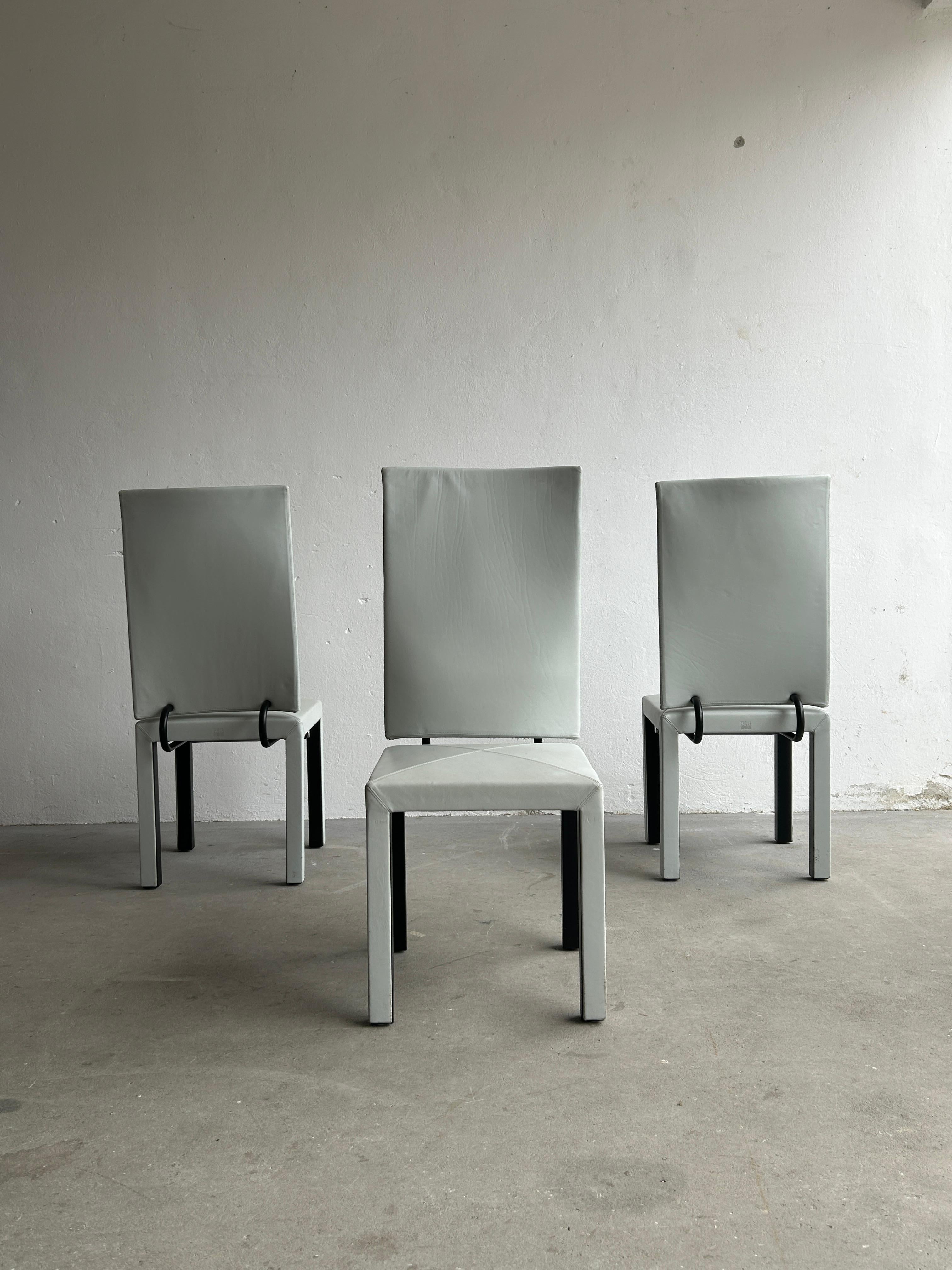 Three amazing 'Arcalla' high back dining chair, from the Arcadia series by Paolo Piva for B&B Italia. Produced by B&B Italia in Italy during the 1990s. . Sculptural, geometrically shaped postmodern structure. In light grey leather