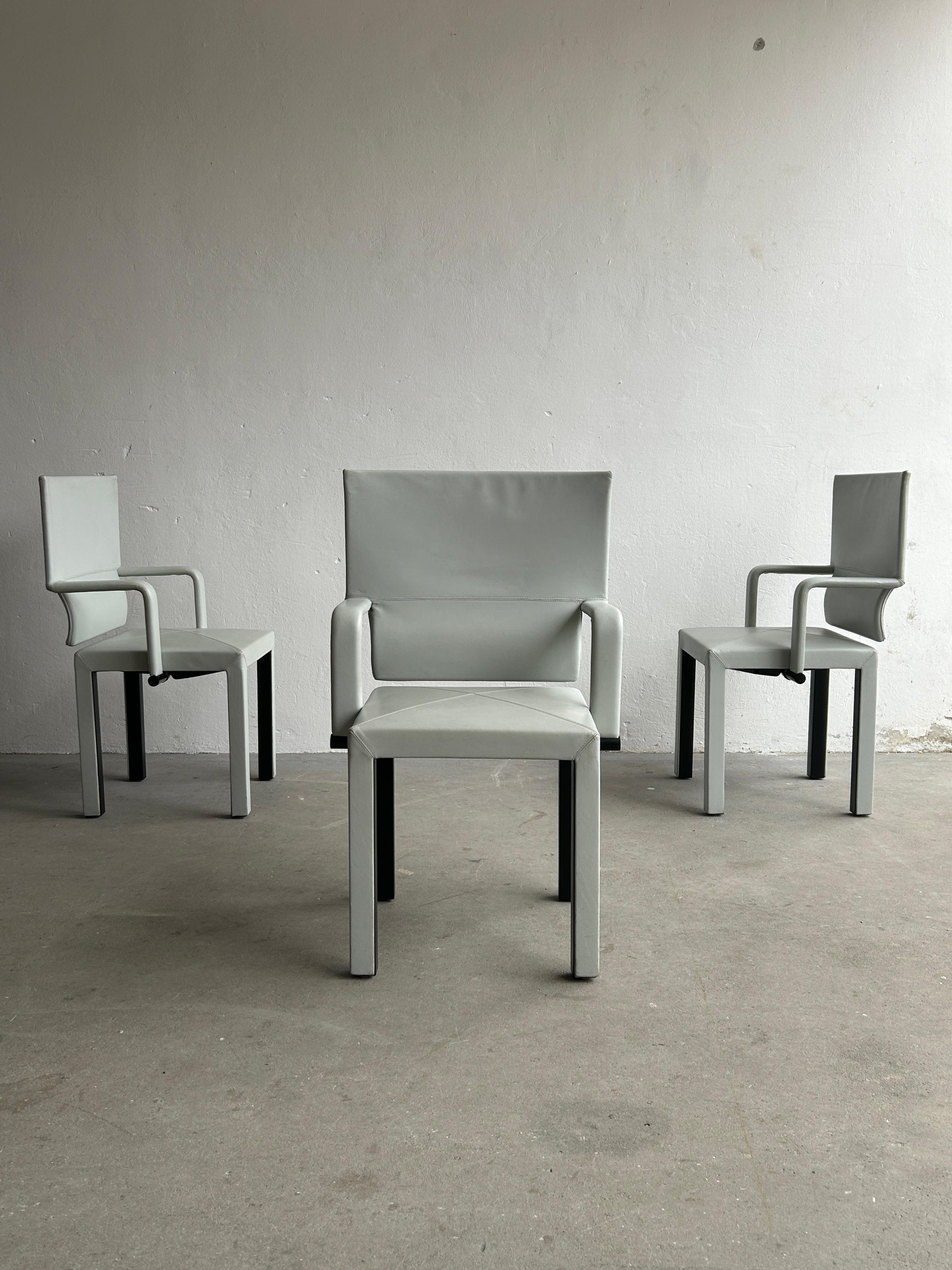 Three amazing 'Arcona' vintage leather armchairs from the Arcadia series by Paolo Piva for B&B Italia. Produced by B&B Italia in Italy during the 1990s. Sculptural, geometrically shaped postmodern structure. In light grey leather edition.

Quality