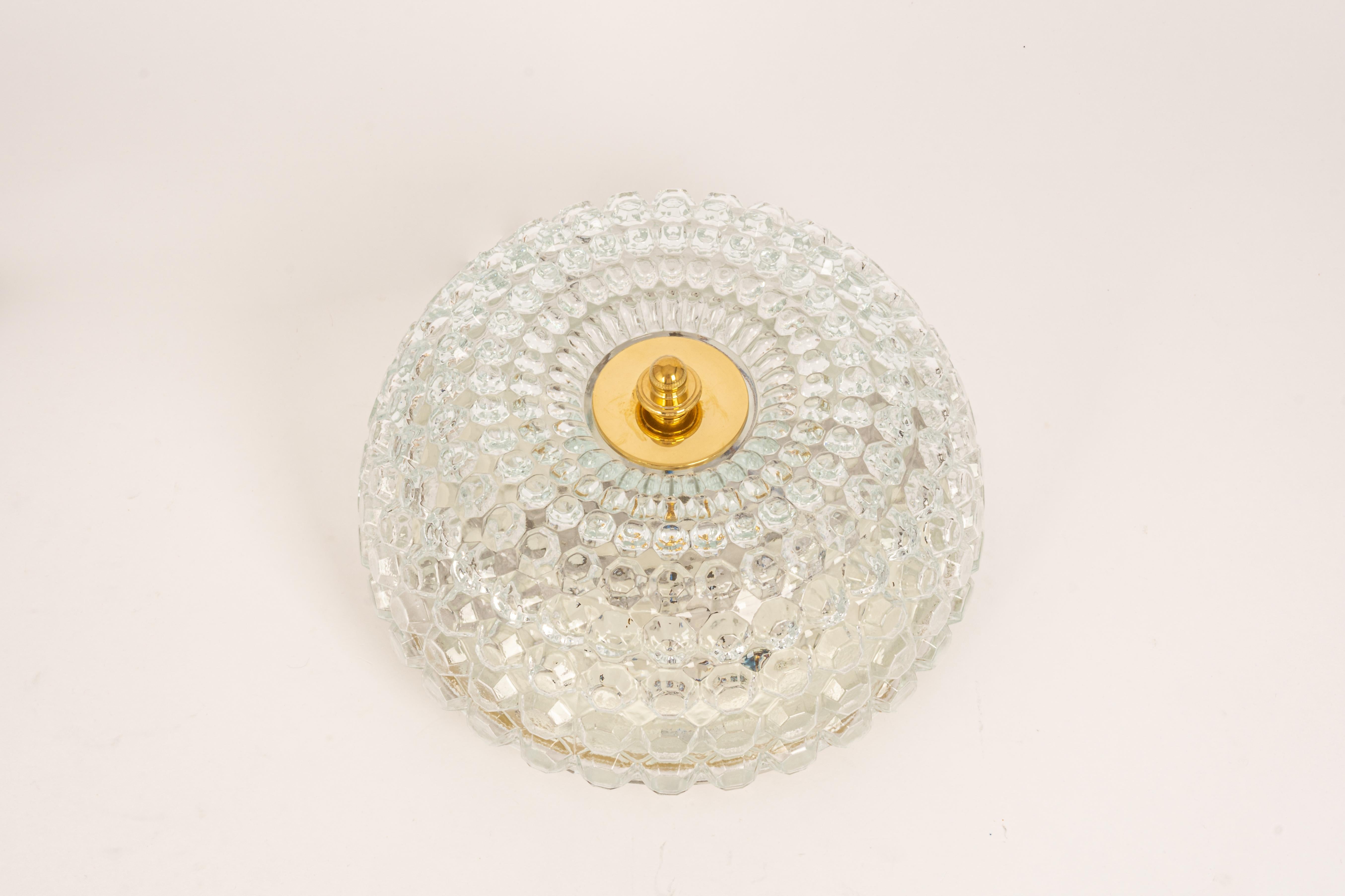 A round clear bubble glass ceiling mount fixture by Limburg, manufactured in Germany, circa the 1970s.

High quality and in very good condition. Cleaned, well-wired, and ready to use. 

Each fixture requires 2 x E27 small bulbs (up to 60 W for