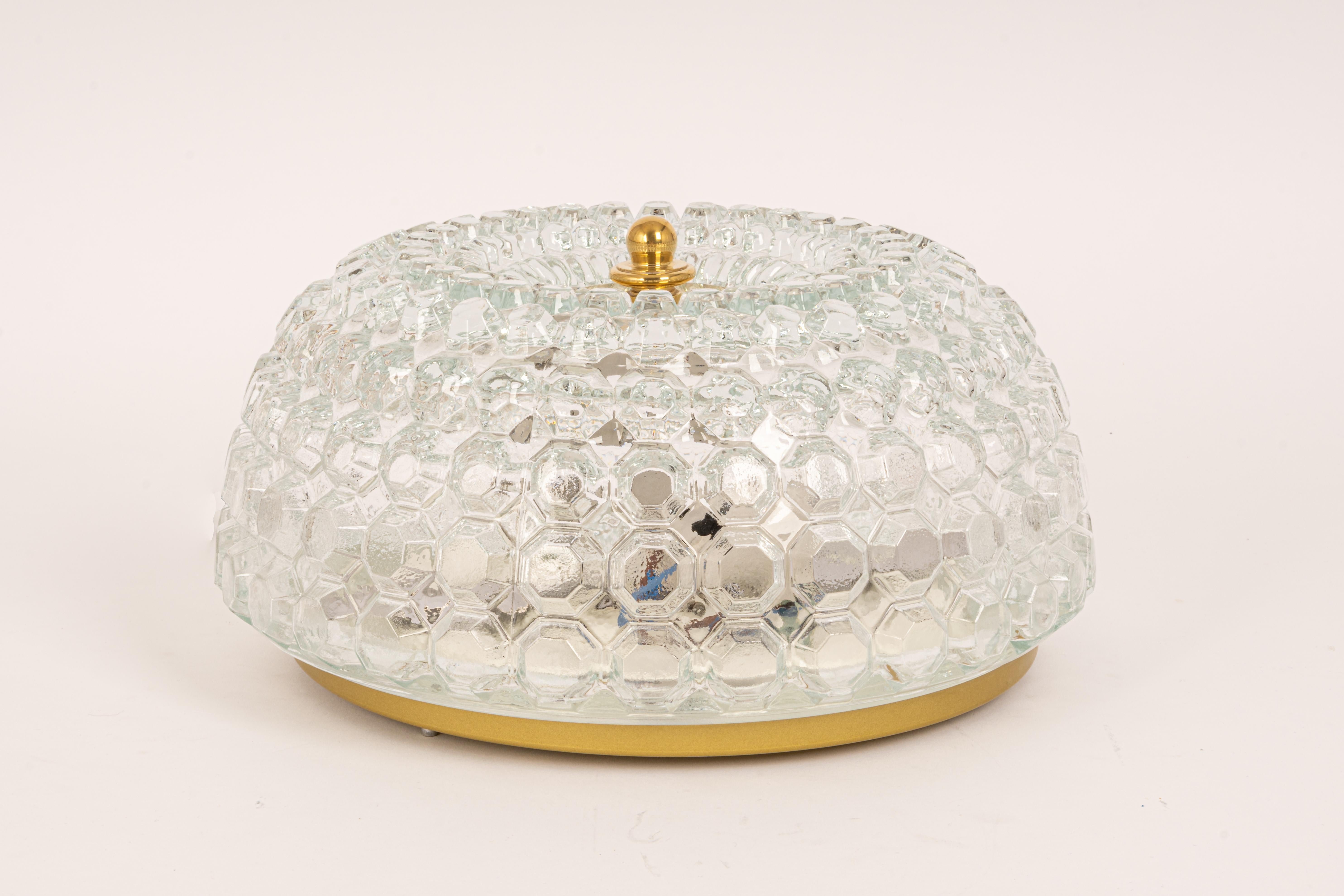 A round clear bubble glass ceiling mount fixture by Limburg, manufactured in Germany, circa the 1970s.

High quality and in very good condition. Cleaned, well-wired, and ready to use. 

Each fixture requires 2 x E27 small bulbs (up to 60 W for