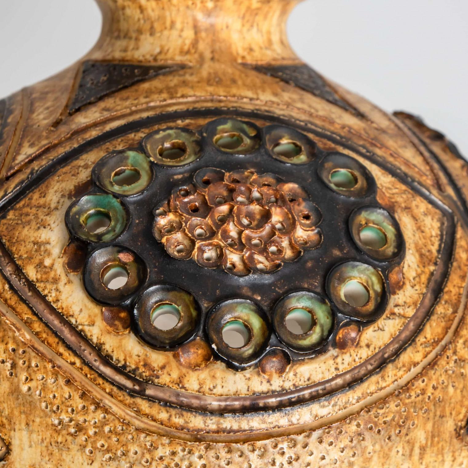 Playful arrangement of stunning round hanging lamps with an unusual shape, made with rich cognac colored brown ceramics, manufactured in the 1970s in Denmark. We have a multitude of unique colored ceramic light sets and arrangements, all available