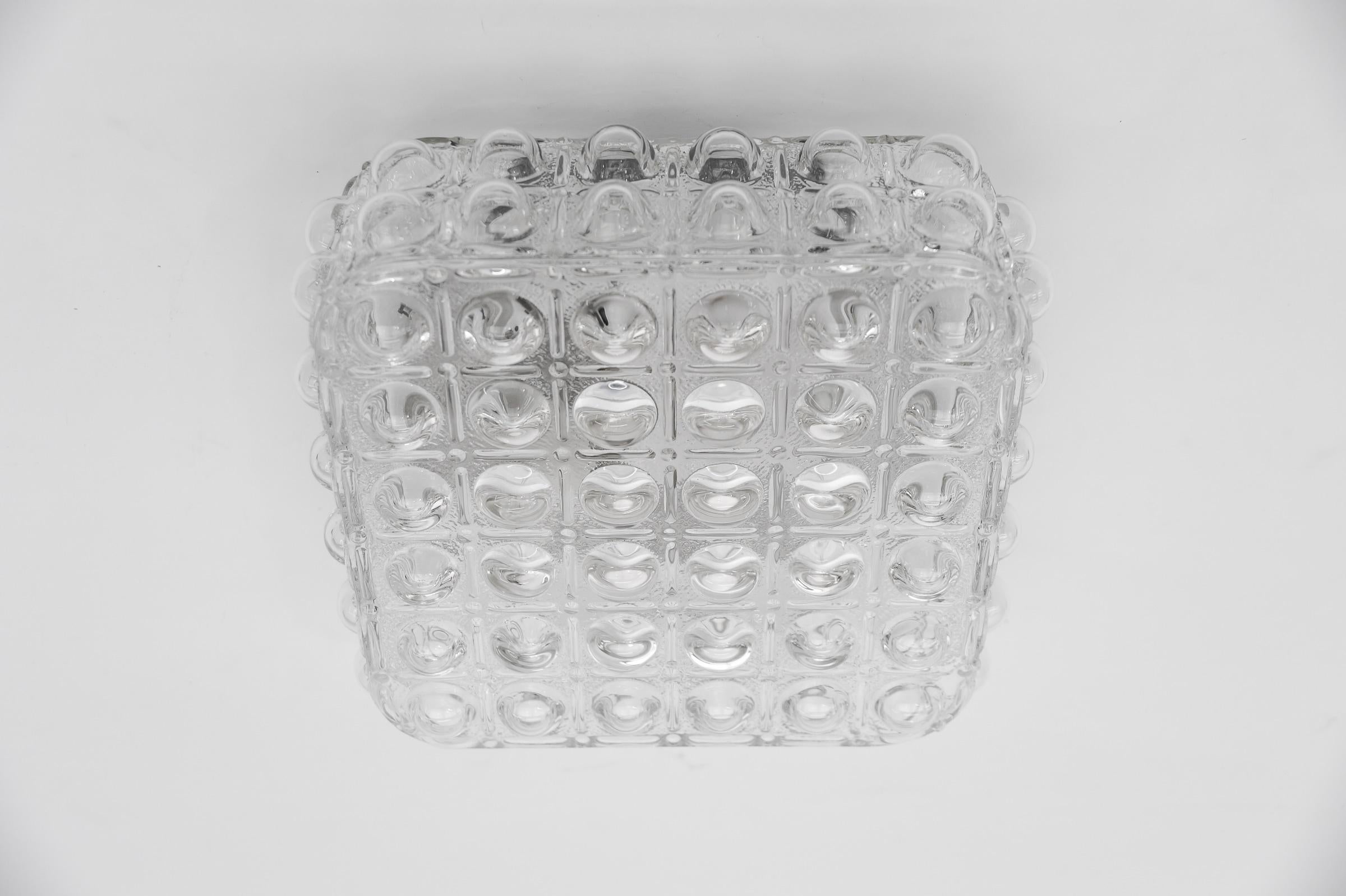 1 of 3 Clear Bubble Glass Flush Mount Lamp by Helena Tynell, Germany 1960s

Dimensions
Height: 4.52 in. (11.5 cm)
Width: 9.84 in. (25 cm)
Depth: 9.84 in. (25 cm)

The fixture need 1 x E27 standard bulb with 60W max.

Light bulbs are not