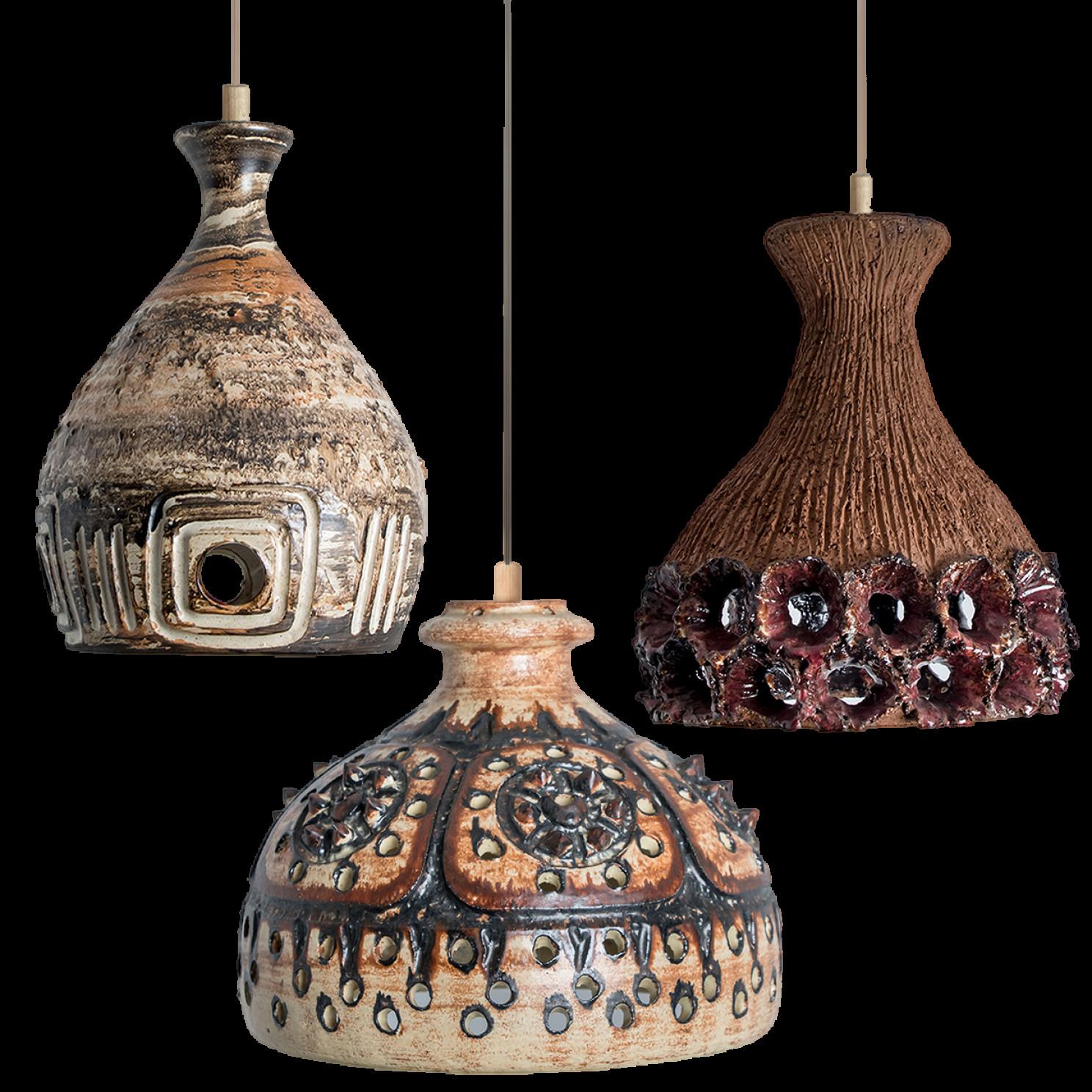 Playful arrangement of stunning round hanging lamps with an unusual shape, made with rich colored brown ceramics, manufactured in the 1970s in Denmark. We have a multitude of unique colored ceramic light sets and arrangements, all available in our