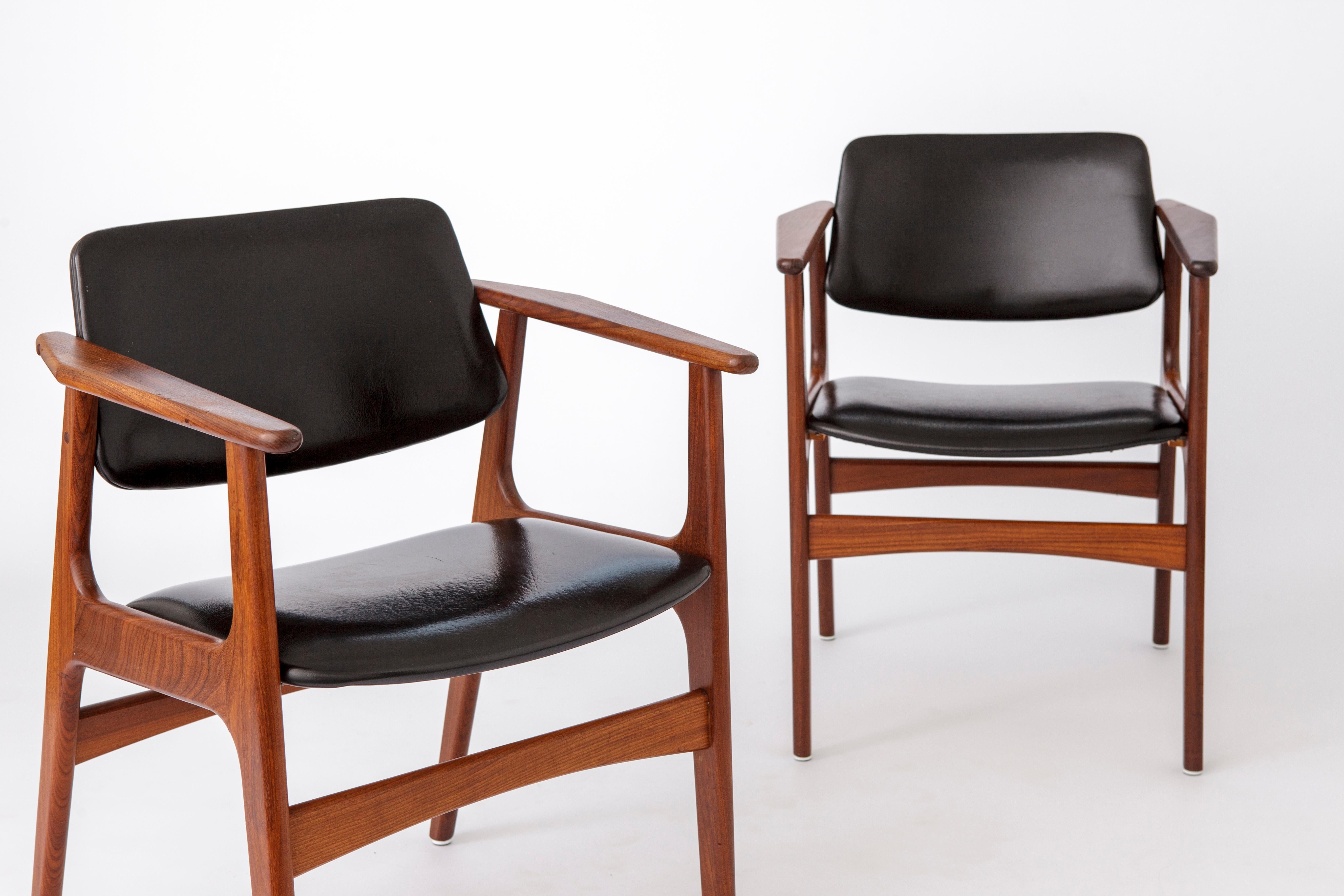 Pair of armchairs by Danish designer Arne Vodder. 
Production period: 1960s. 
Displayed price is for 2 armchairs. 

Stable and sturdy teak frames. No cracks or repairs. 
Original black artificial leather seat and back cover in very good condition. 