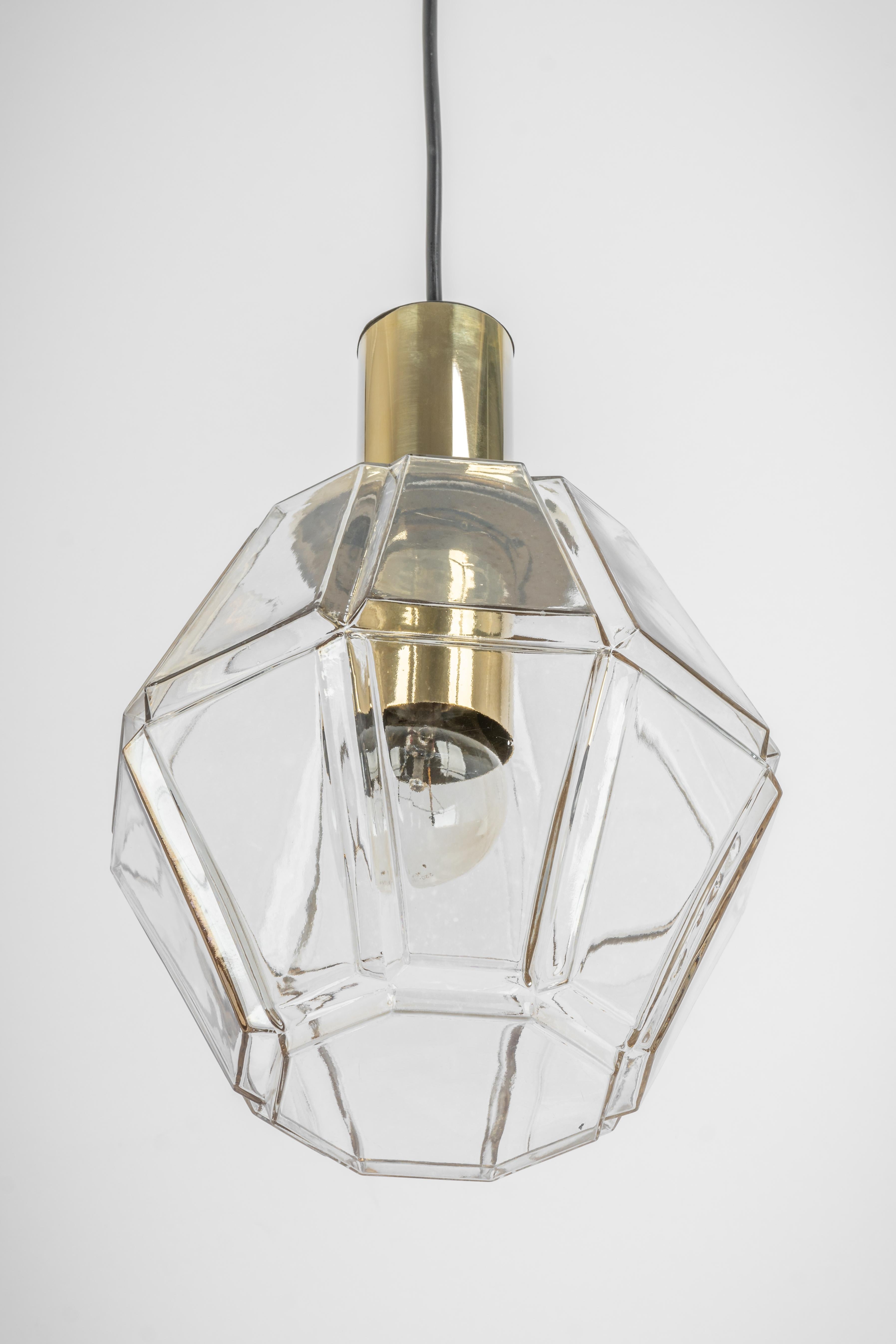 1 of 3 petite glass (with brass cups ) pendant designed by Helena Tynell for Limburg, manufactured in Germany, circa 1970s

Sockets: It needs 1 x E27 standard bulb.
Light bulbs are not included. It is possible to install this fixture in all