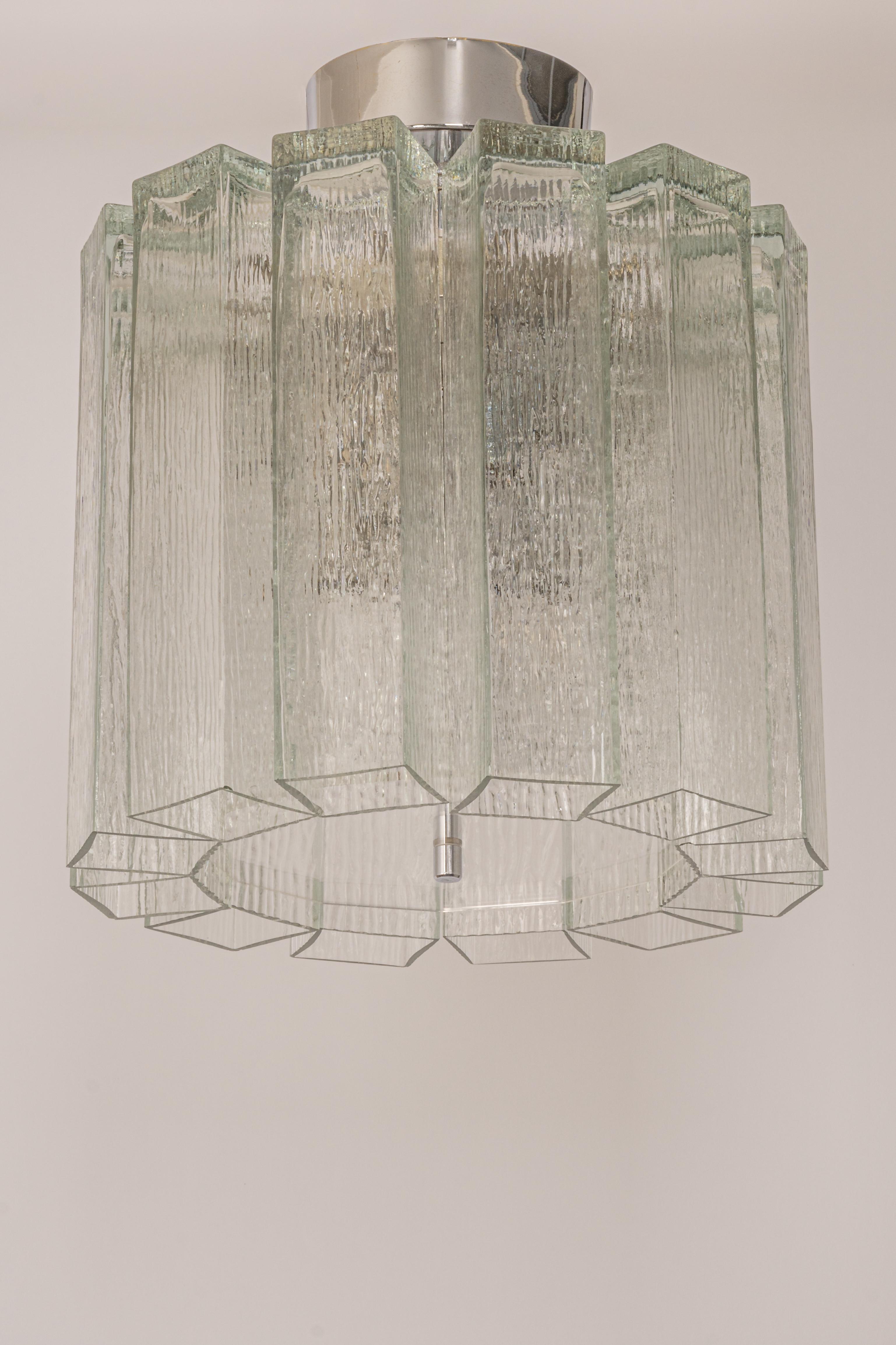 Fantastic mid-century chandelier by Limburg, Germany, manufactured circa 1960-1969. 12 glass cylinders are suspended from the fixture.
Very good condition. Cleaned, well-wired, and ready to use.

Each fixture requires 8 x E14 small bulbs with 40W