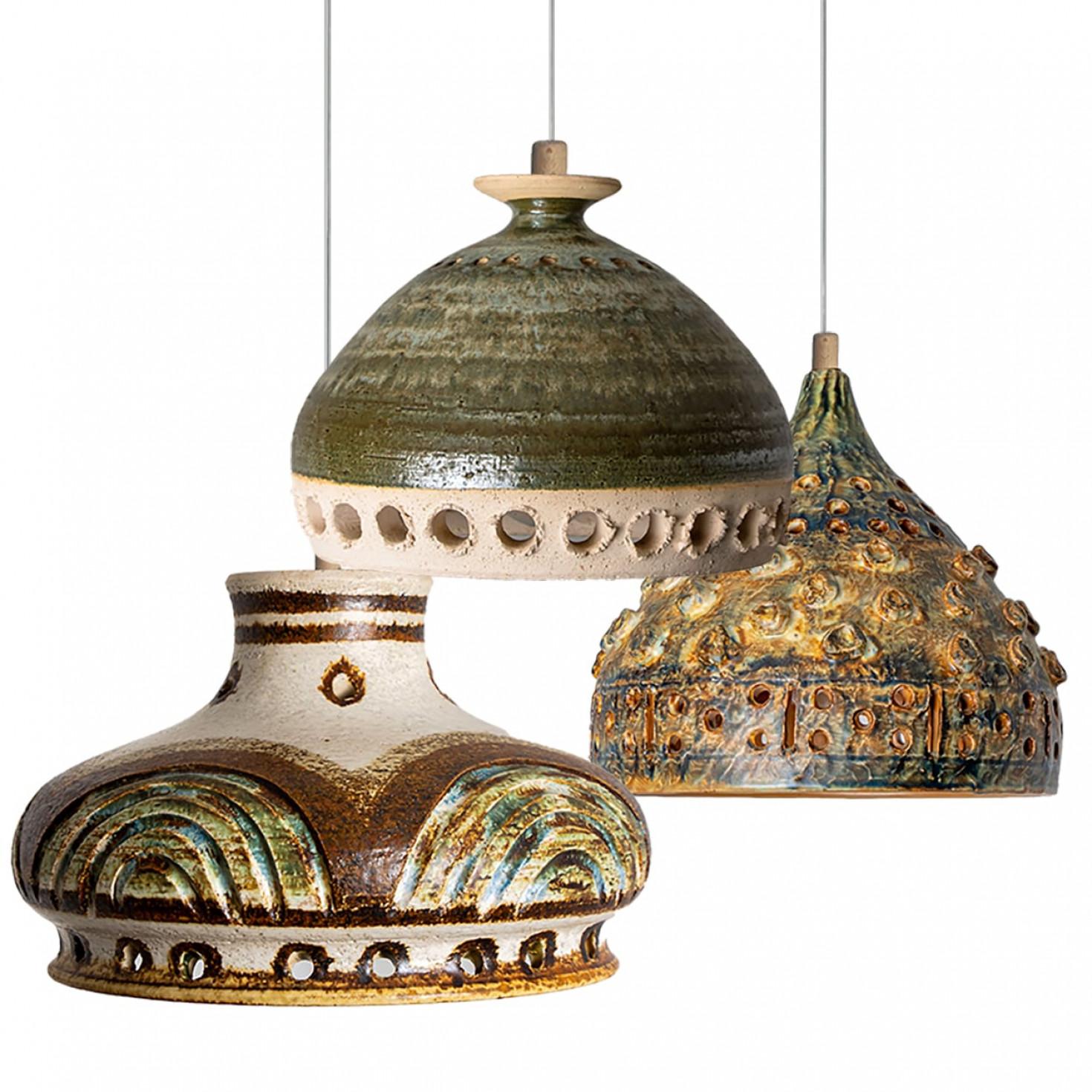 Playful arrangement of stunning round hanging lamps with an unusual shape, made with rich light colored brown ceramics, manufactured in the 1970s in Denmark. We have a multitude of unique colored ceramic light sets and arrangements, all available in