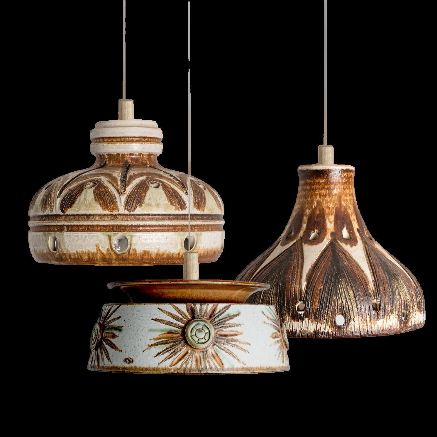 Playful arrangement of stunning round hanging lamps with an unusual shape, made with rich brown colored brown ceramics, manufactured in the 1970s in Denmark. We have a multitude of unique colored ceramic light sets and arrangements, all available in