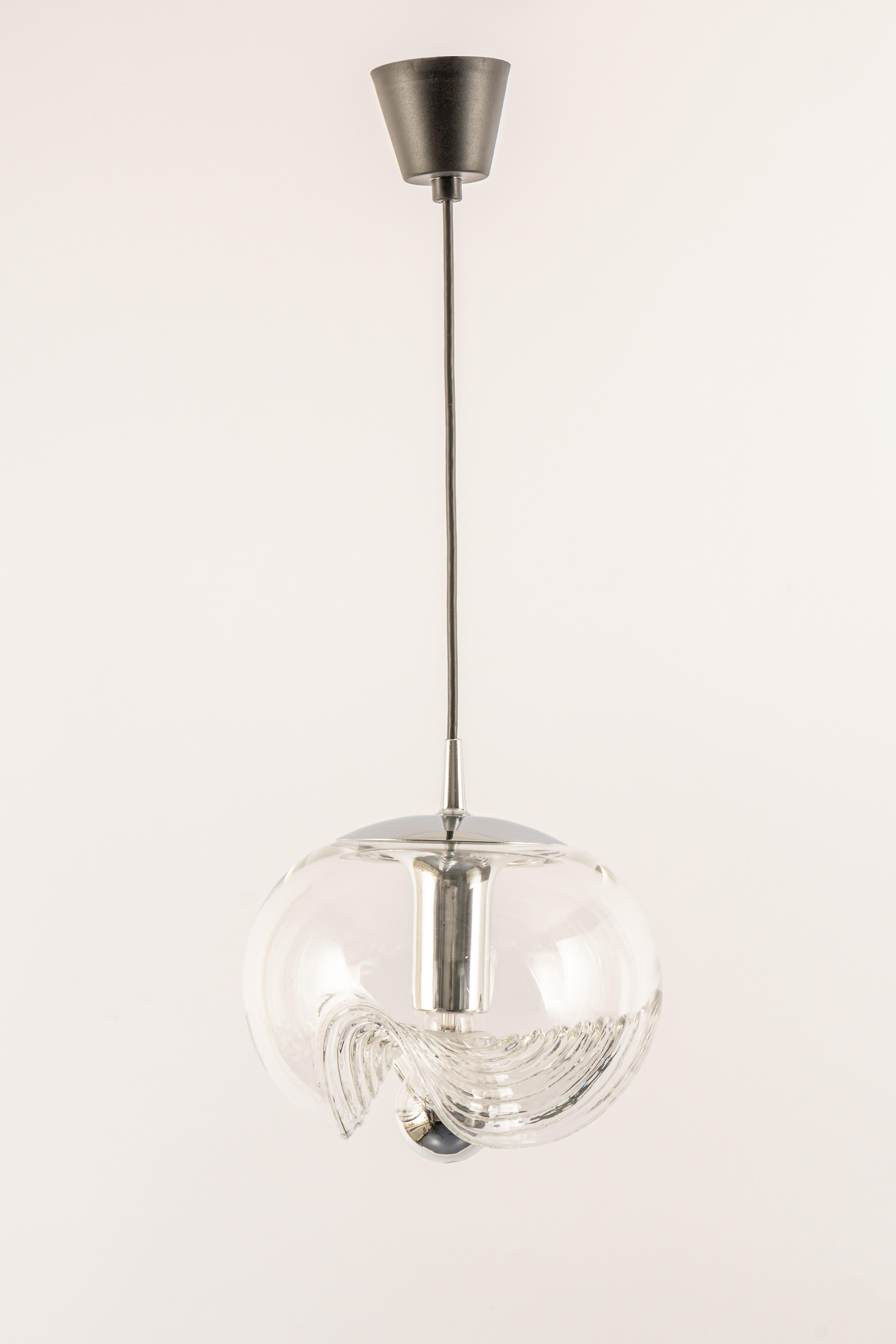 A special round Biomorphic clear glass pendant designed by Koch & Lowy for Peill & Putzler, manufactured in Germany, circa 1970s.
High quality and in very good condition. Cleaned, well-wired, and ready to use. 
Each fixture requires a 1 x E27