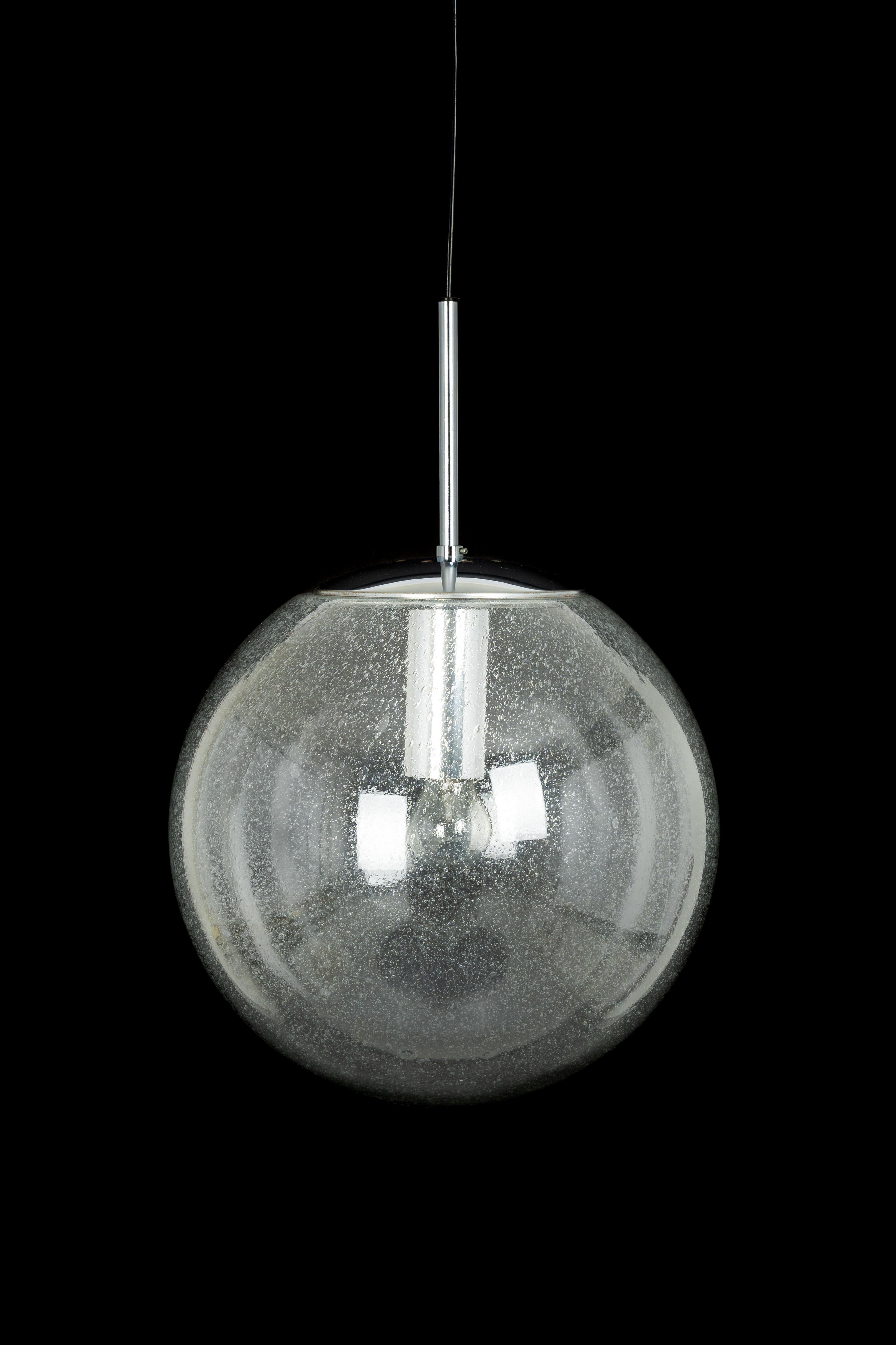 1 of 2 large smoked glass ball pendants, manufactured by Limburg, Germany, circa 1970-1979.

Sockets: One x E27 standard bulb 
Light bulbs are not included. It is possible to install this fixture in all countries (US, UK, Europe, Asia,