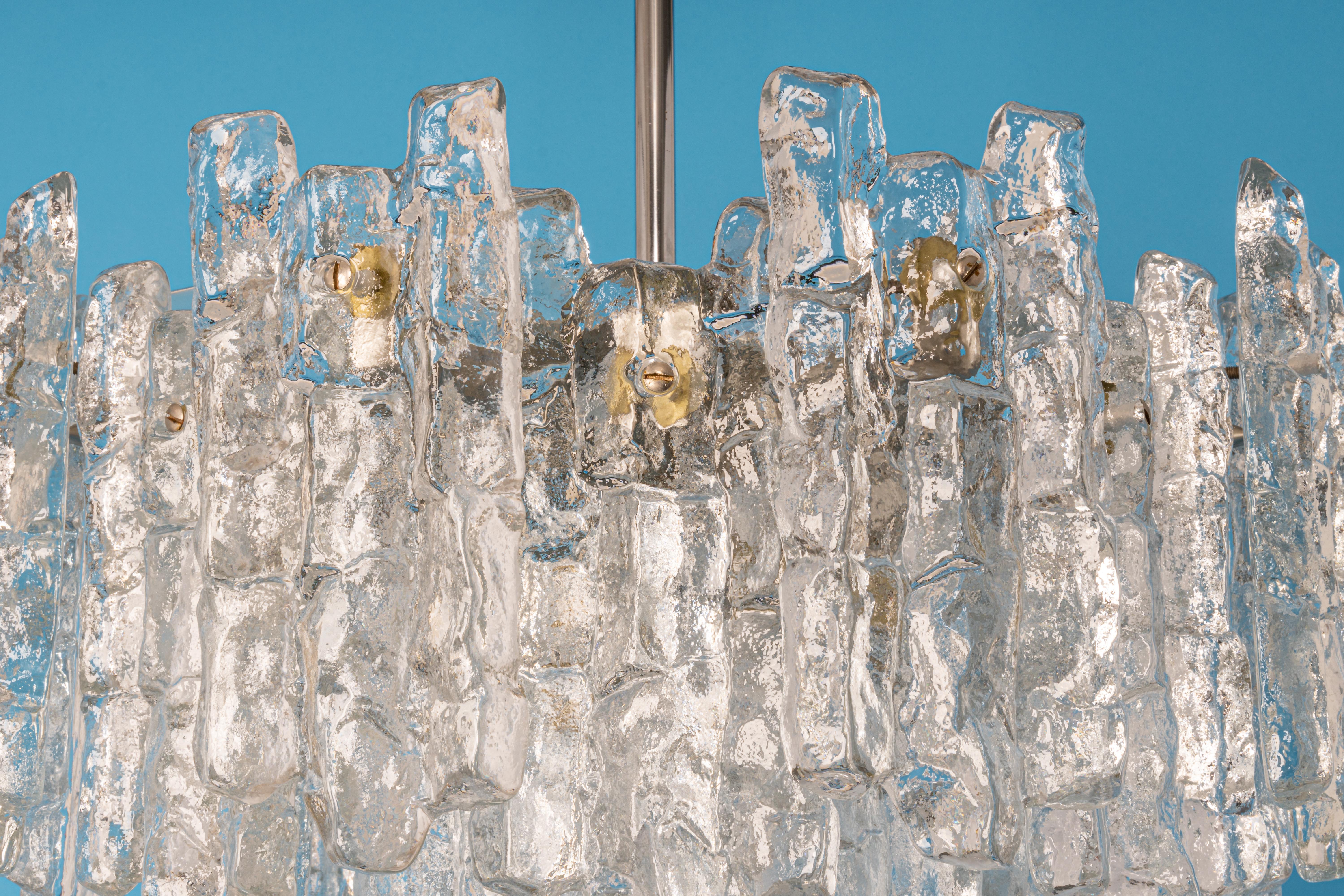 Stunning Murano glass chandelier by Kalmar, 1960s
Three tiers structure gathering 28 structured glasses, beautifully refracting the light very heavy quality.

High quality and in very good condition. Cleaned, well-wired, and ready to use. 

The