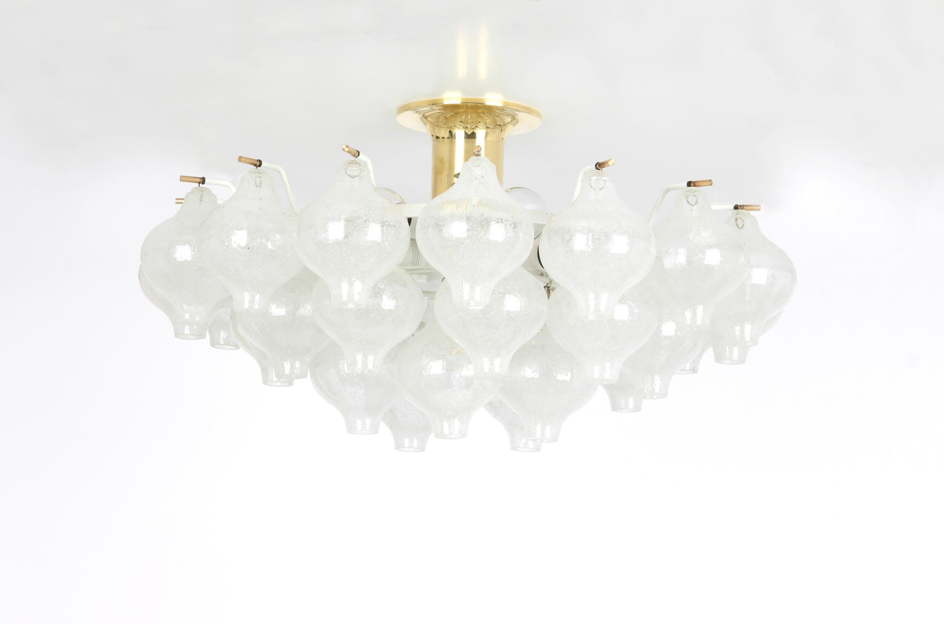 Wonderful onion-shaped -Tulipan glass chandelier. 30 hand blown glasses suspended on a white painted metal frame.
Best of design from the 1960s by Kalmar, Austria. High quality of the materials.

Sockets: The chandelier takes 9 small screw base