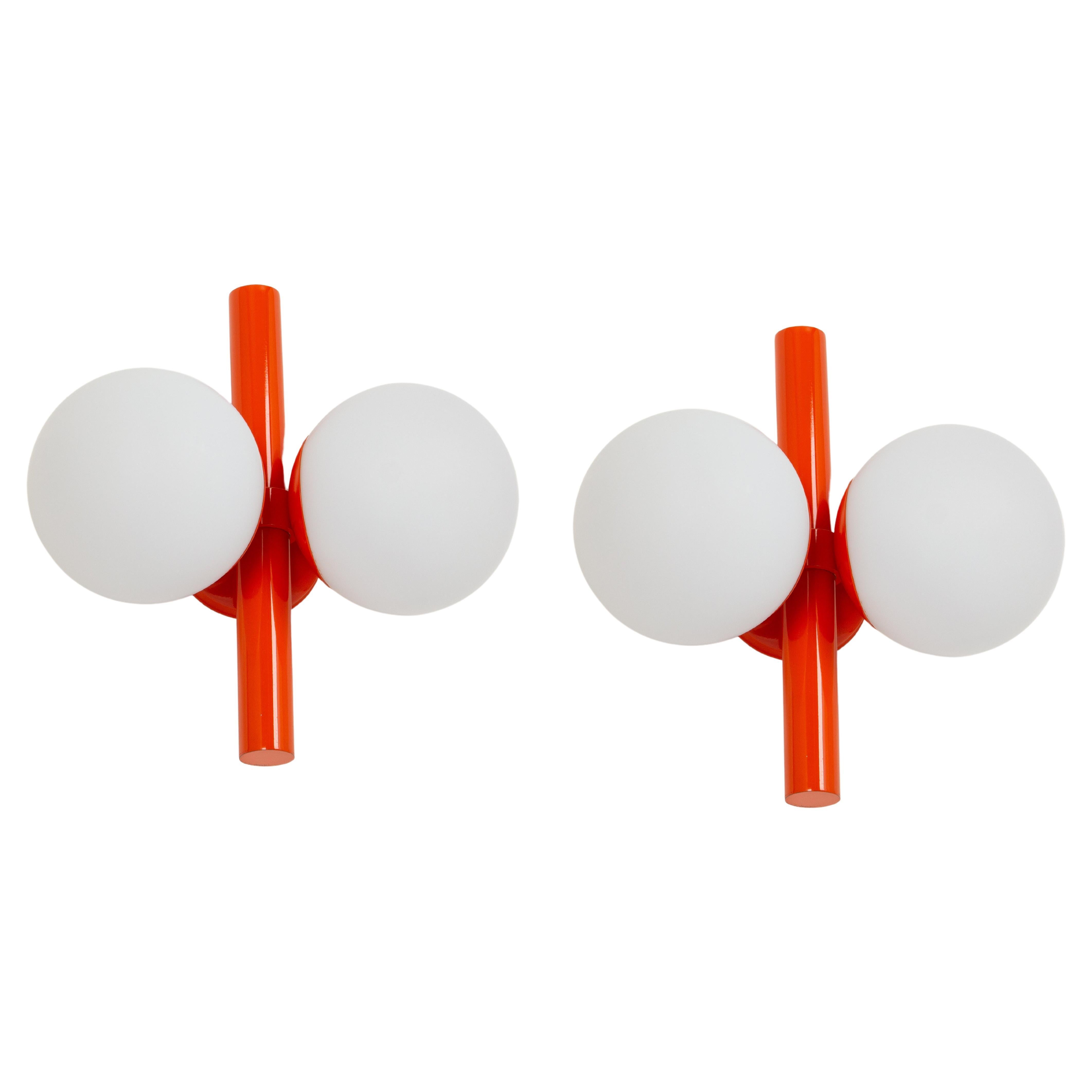 1 of 3 mid-century vintage wall lights in orange color made by Kaiser Leuchten, Germany, with two opal glass balls.
High quality and in very good condition. Cleaned, well-wired, and ready to use. 

Each fixture requires 2 x E14 small bulbs with 40W