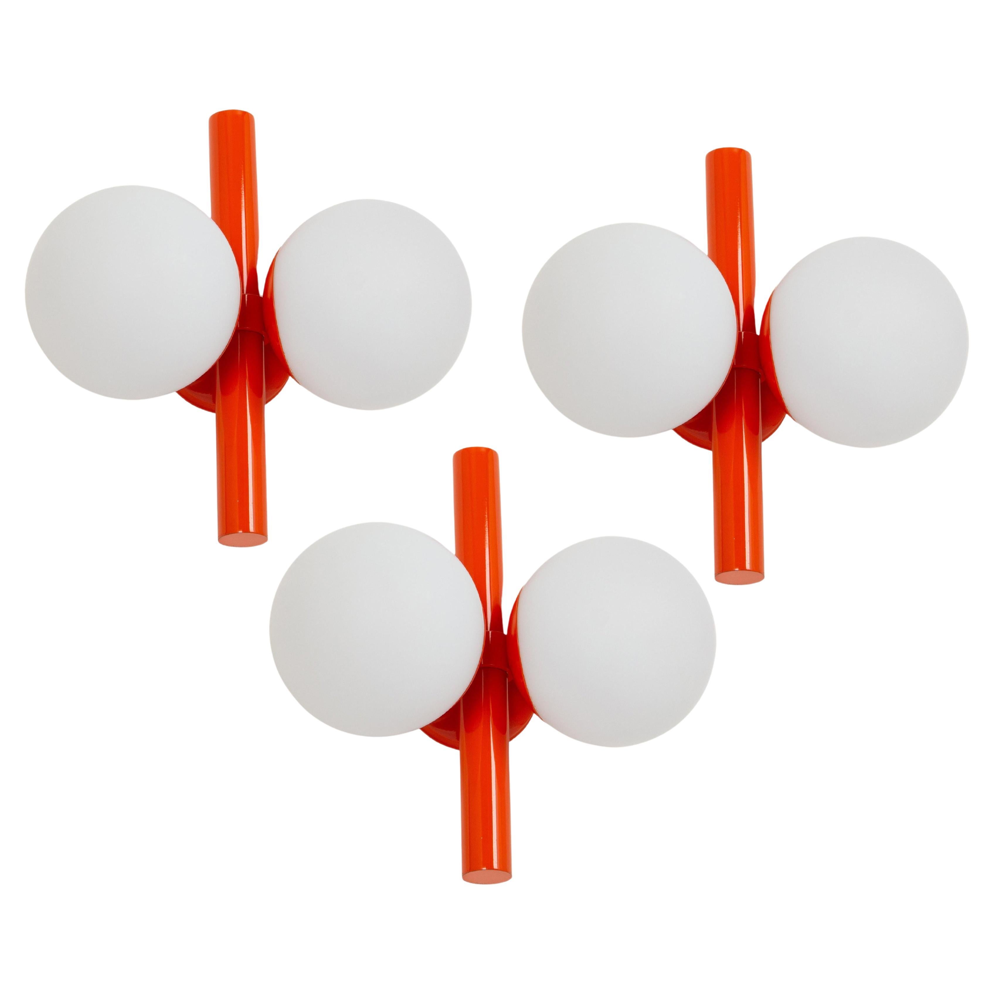 1 of 3 Midcentury Orbital Wall lights in Orange by Kaiser, Germany, 1970s For Sale