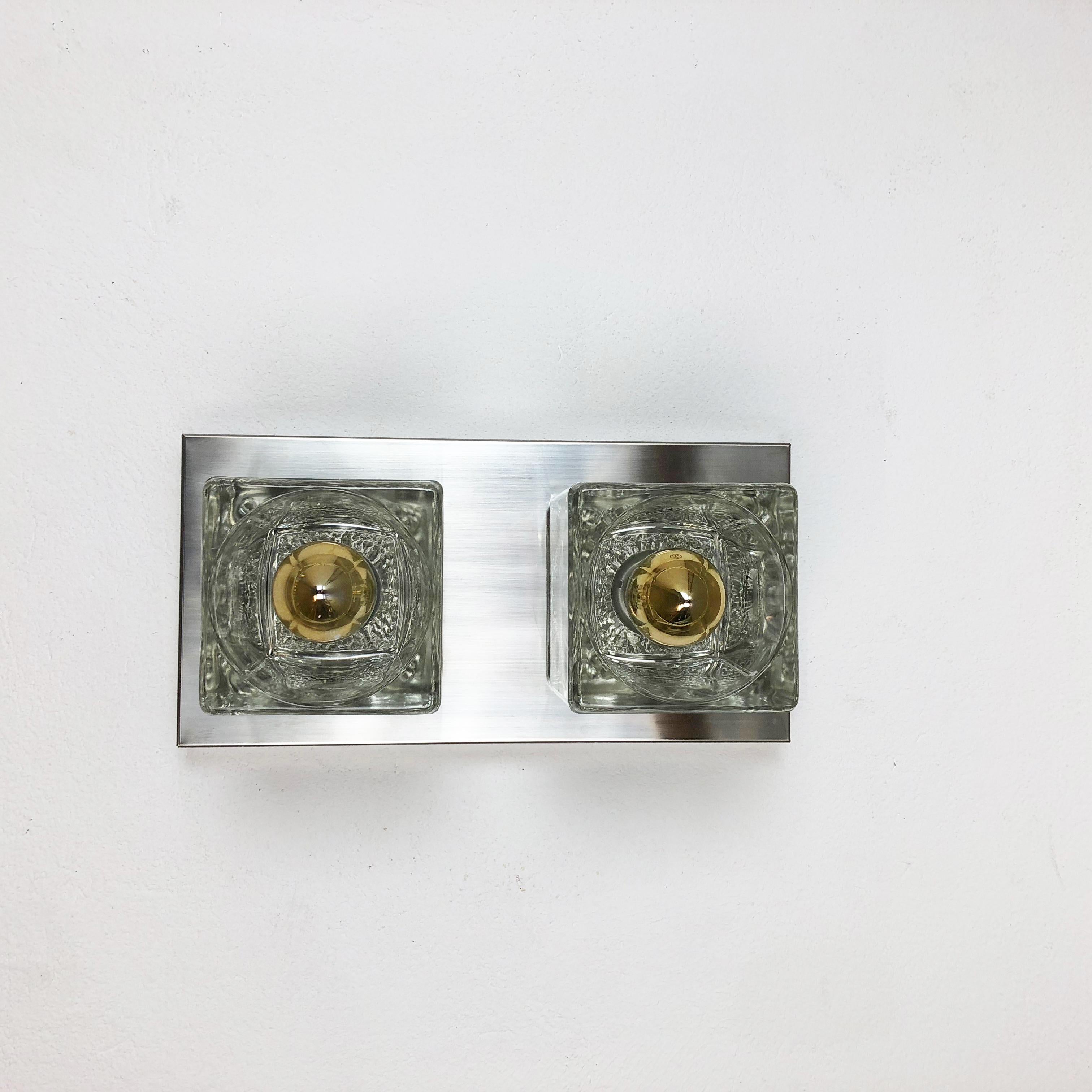 Article:

1 of 2 wall ceiling lights


Producer:

Peill & Putzler, Germany (see label on image)


Origin:

Germany


Age:

1970s



Description:

Original 1970s modernist wall Lights with ice cube form glass lighting elements and a wall metal