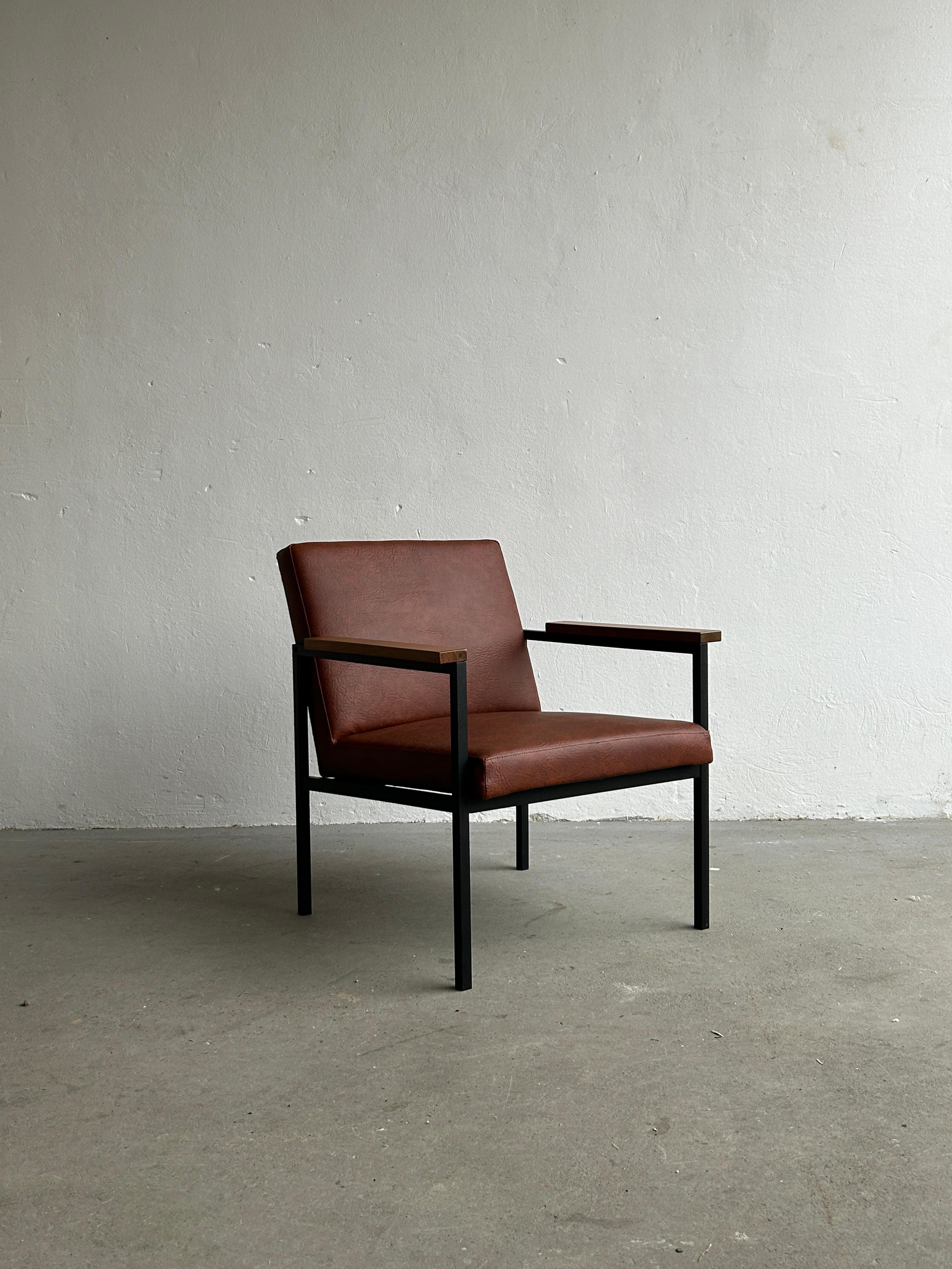 Set of three beautiful vintage Mid-Century-Modern cognac brown faux leather and black frame armchair with wooden beech armrests. Designed by Niko Kralj and produced by Stol Kamnik, Yugoslavia, during the 1970s. 

A stunning piece of original MCM
