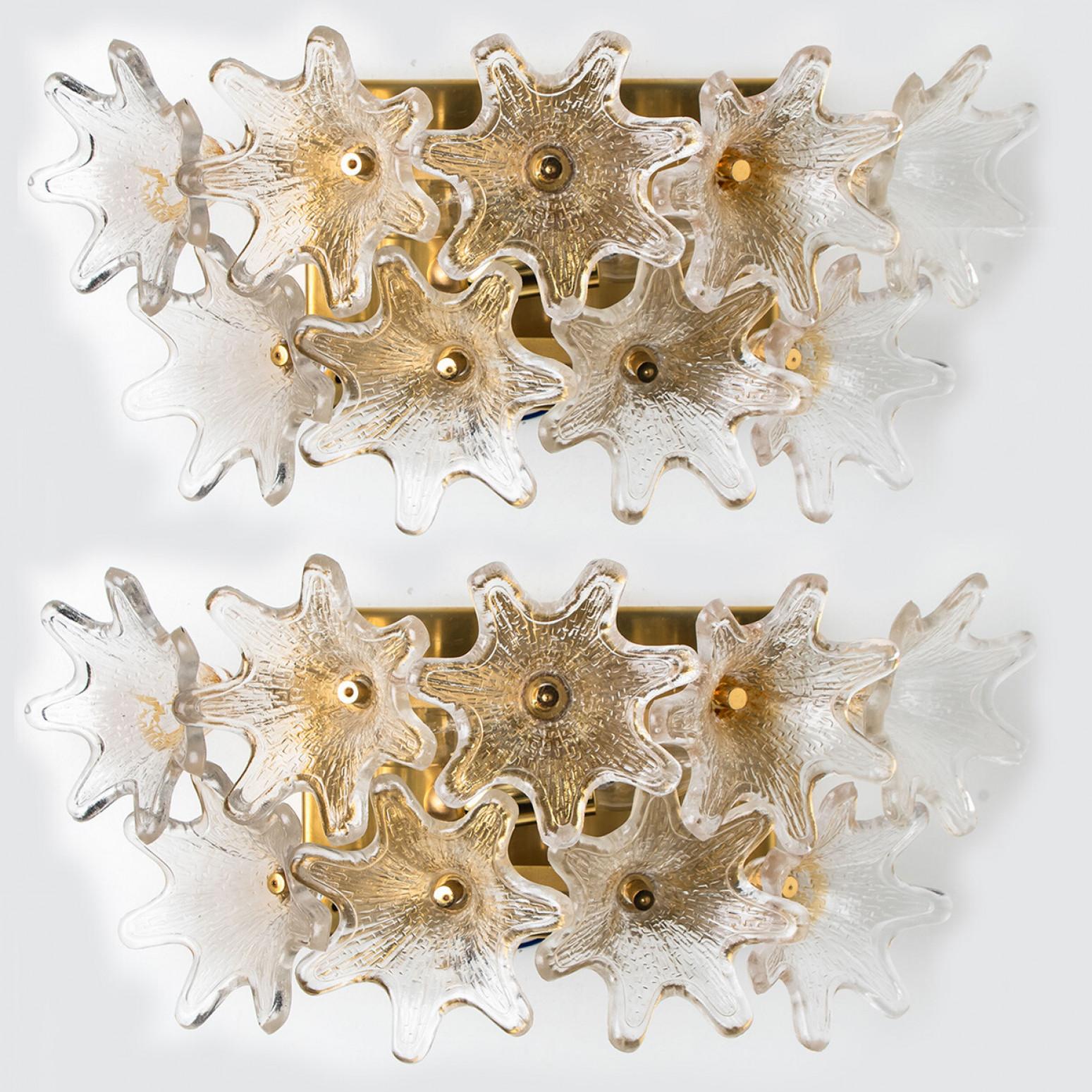 One of the three pairs of light fixtures by Paolo Venini for VeArt, Italy, 1960s. Brass hardware. Several star shaped clear resembles flowers. The fixture illuminates beautifully on wall.

Exceptional pieces and in this quantity extreme rare to