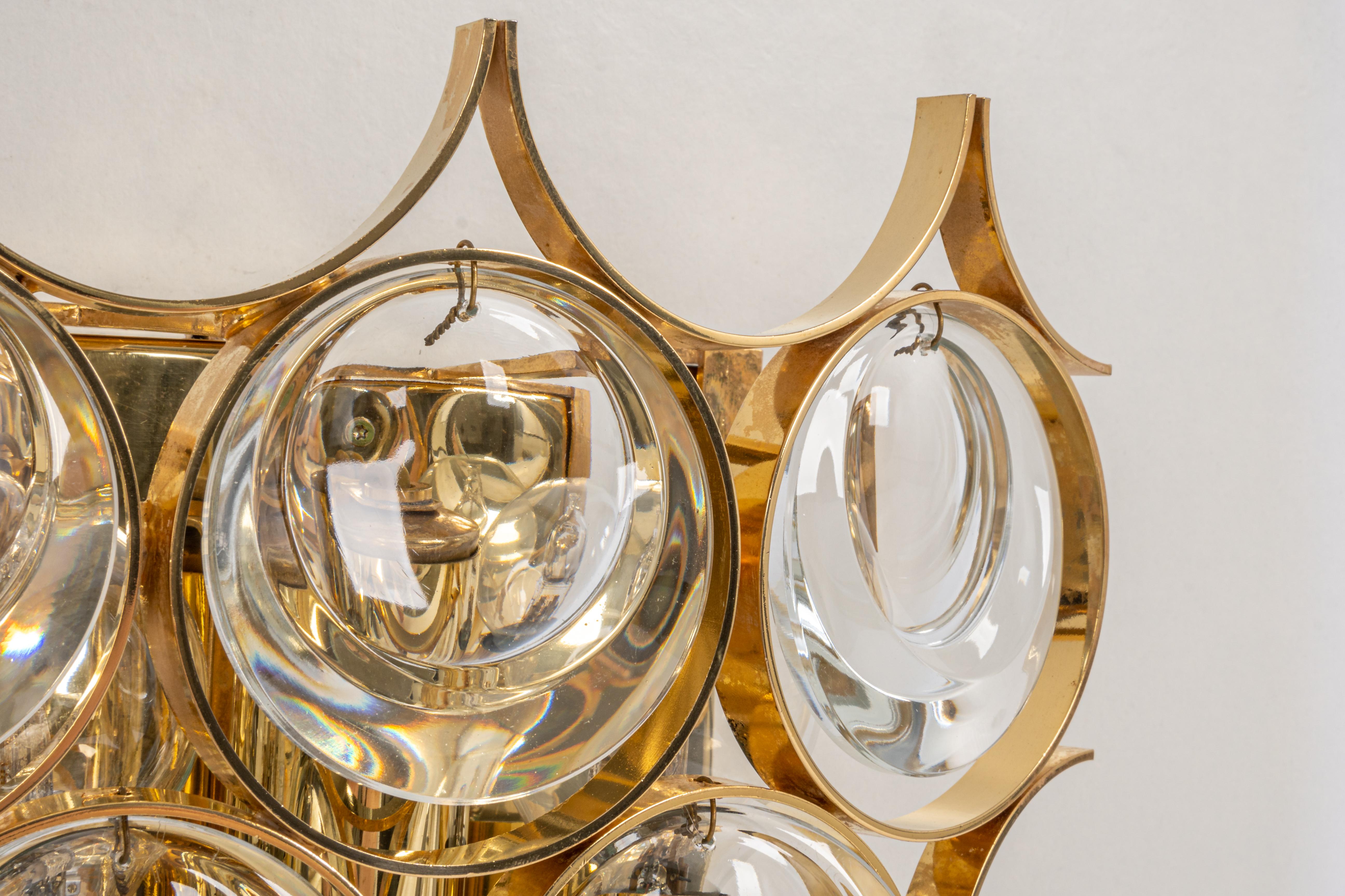 A pair of stunning golden sconces, made by Palwa, design Sciolari Style- Germany, circa 1960-1969.
Crystal glasses on a gilt brass frame.
Best of the 1960s from Germany.

High quality and in very good condition. Cleaned, well-wired and ready to use.